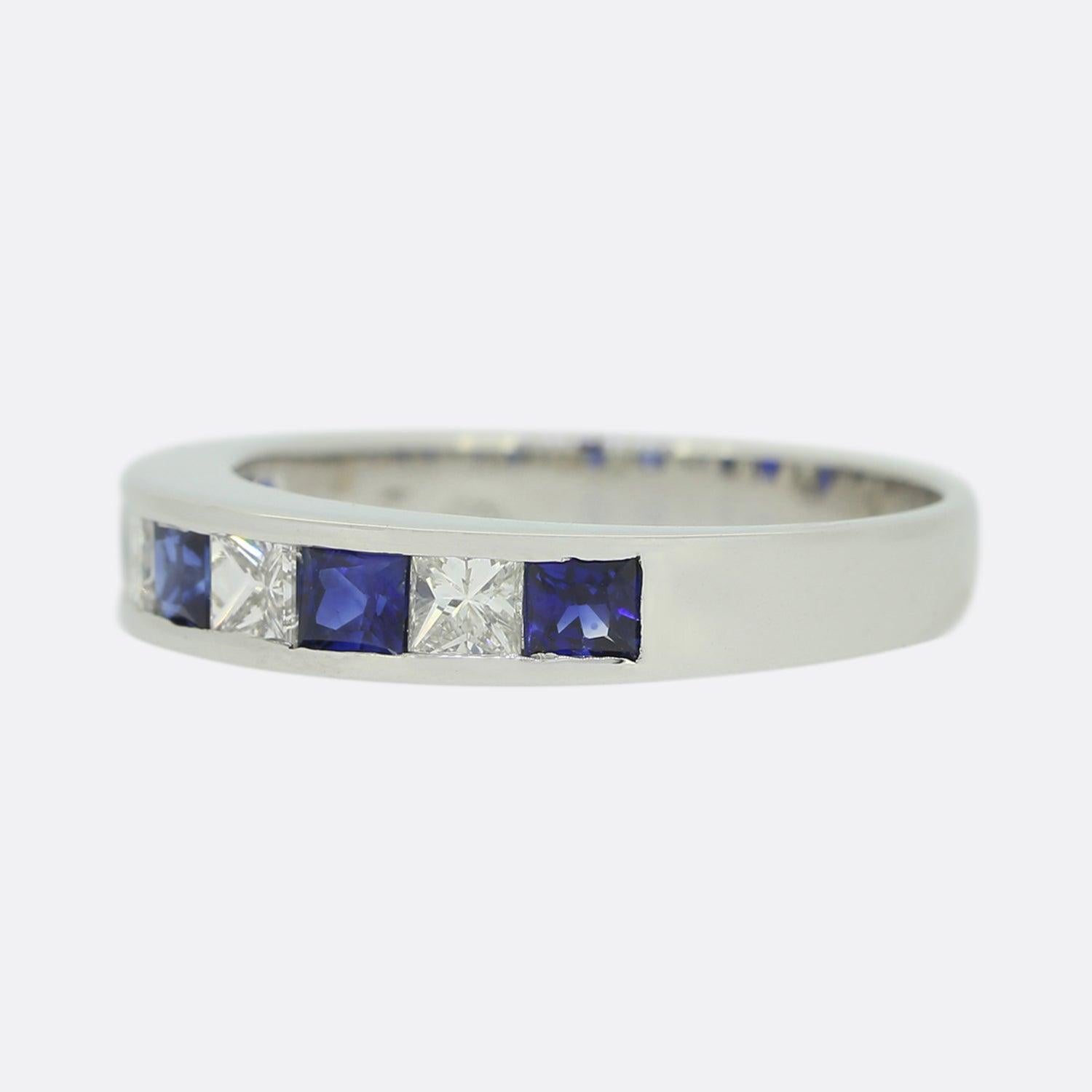 This is a contemporary sapphire and diamond eternity ring. The ring plays host to an alternating pattern of princess cut diamonds and princess cut blue sapphires that are well matched for colour, size and presence. The ring has been crafted in 18ct