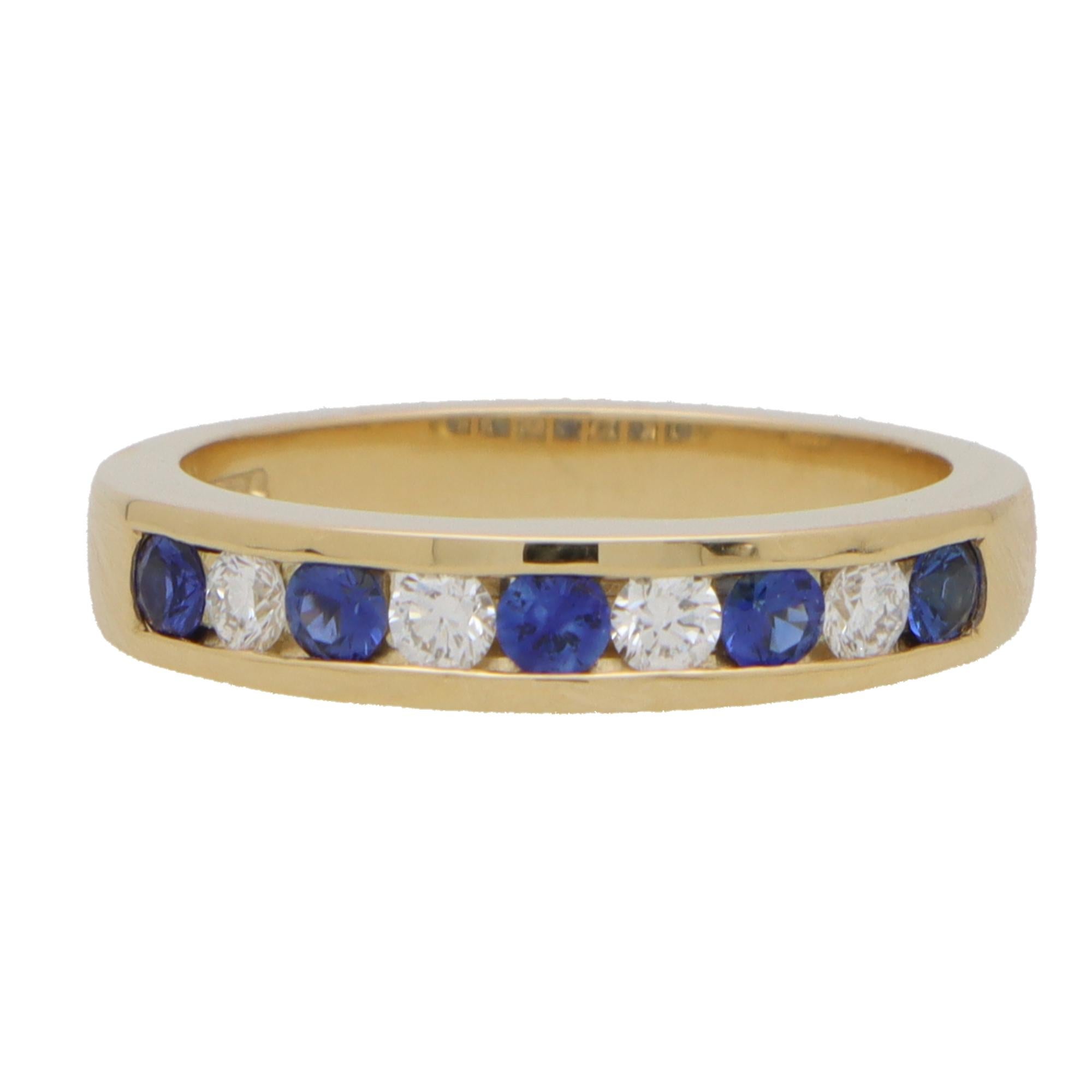 A lovely diamond and sapphire half eternity ring set in 18k yellow gold. 

The ring is composed of 9 round cut stones altogether, 5 of which being sapphires and 4 diamonds. All the stones are bezel set within a 4mm yellow gold band.

The contrast