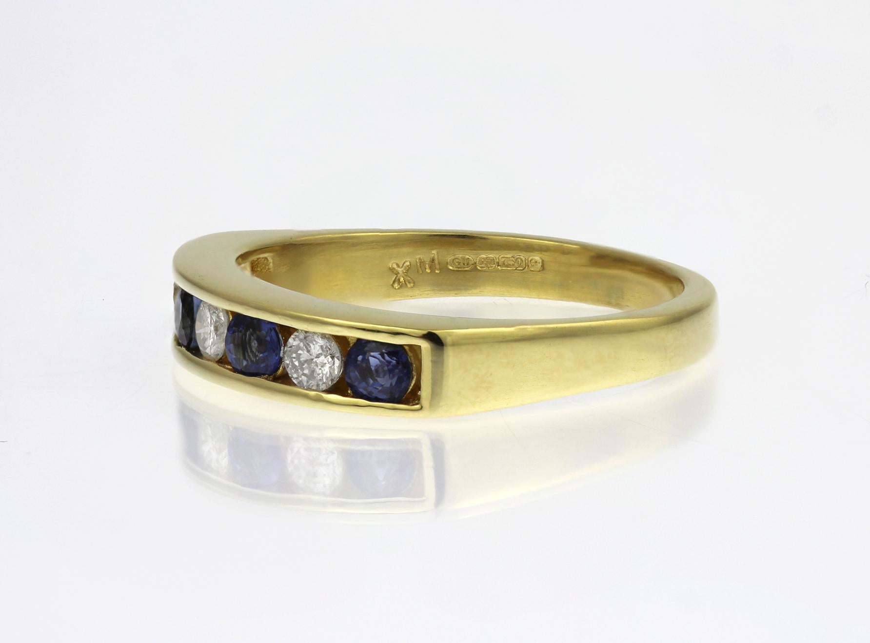 18ct yellow gold half eternity ring featuring four round cornflower blue sapphires alternated with 3 round brilliant cut diamonds weighing 0.20ct, colour I/J, clarity SI/I.  A classic, elegant style.

Channel setting:
3 x round diamonds, approximate