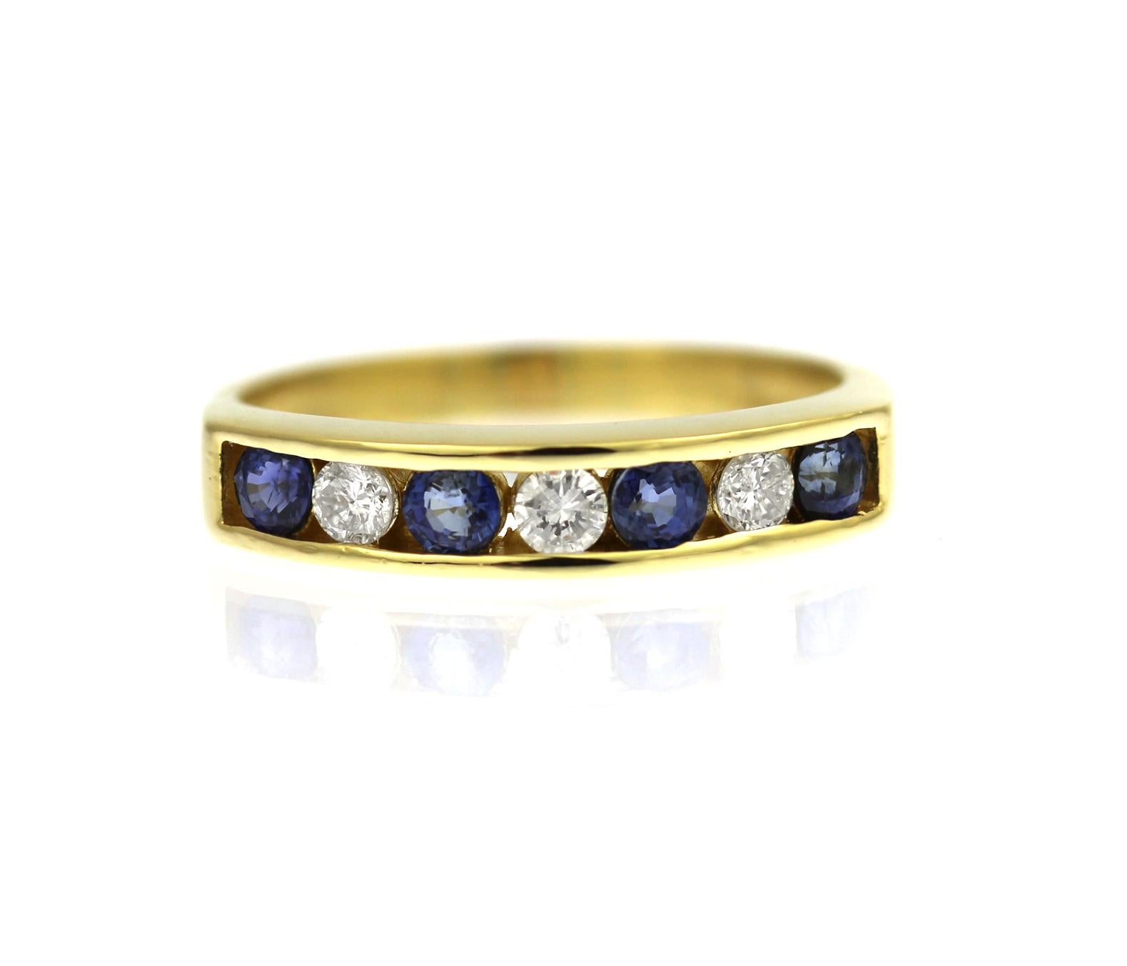 Round Cut Sapphire and diamond half eternity channel set ring in 18ct yellow gold For Sale