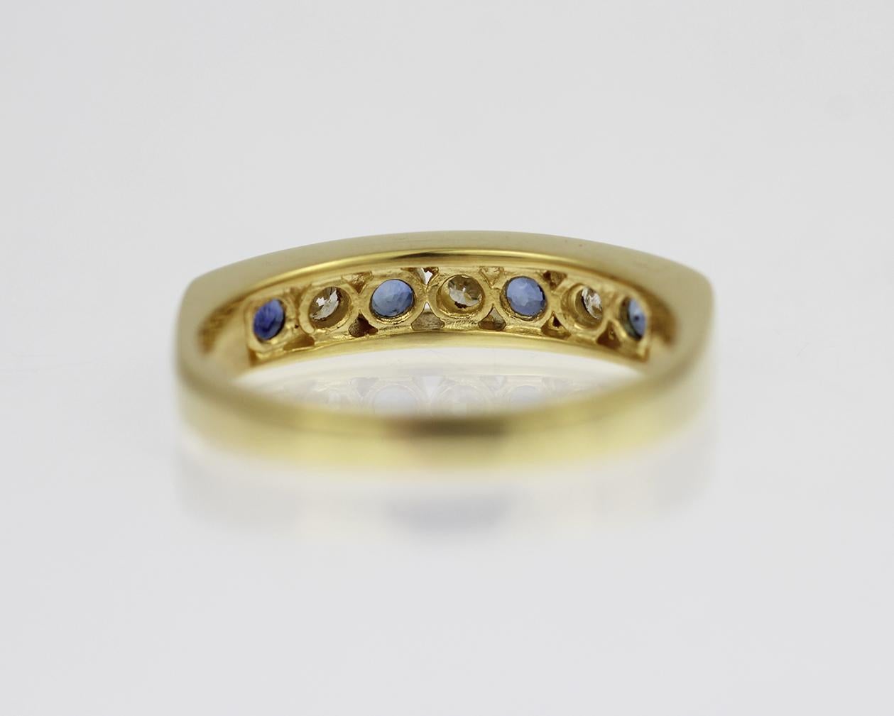 Sapphire and diamond half eternity channel set ring in 18ct yellow gold In Excellent Condition For Sale In London, GB