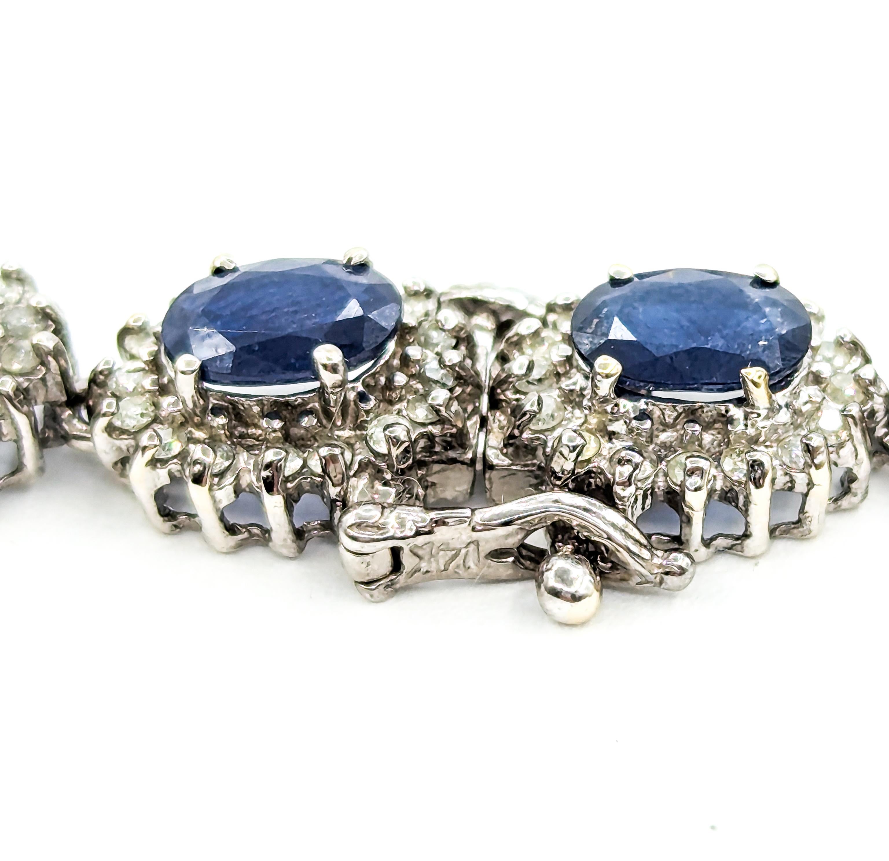 Oval Cut Sapphire and Diamond Halo Bracelet in White Gold