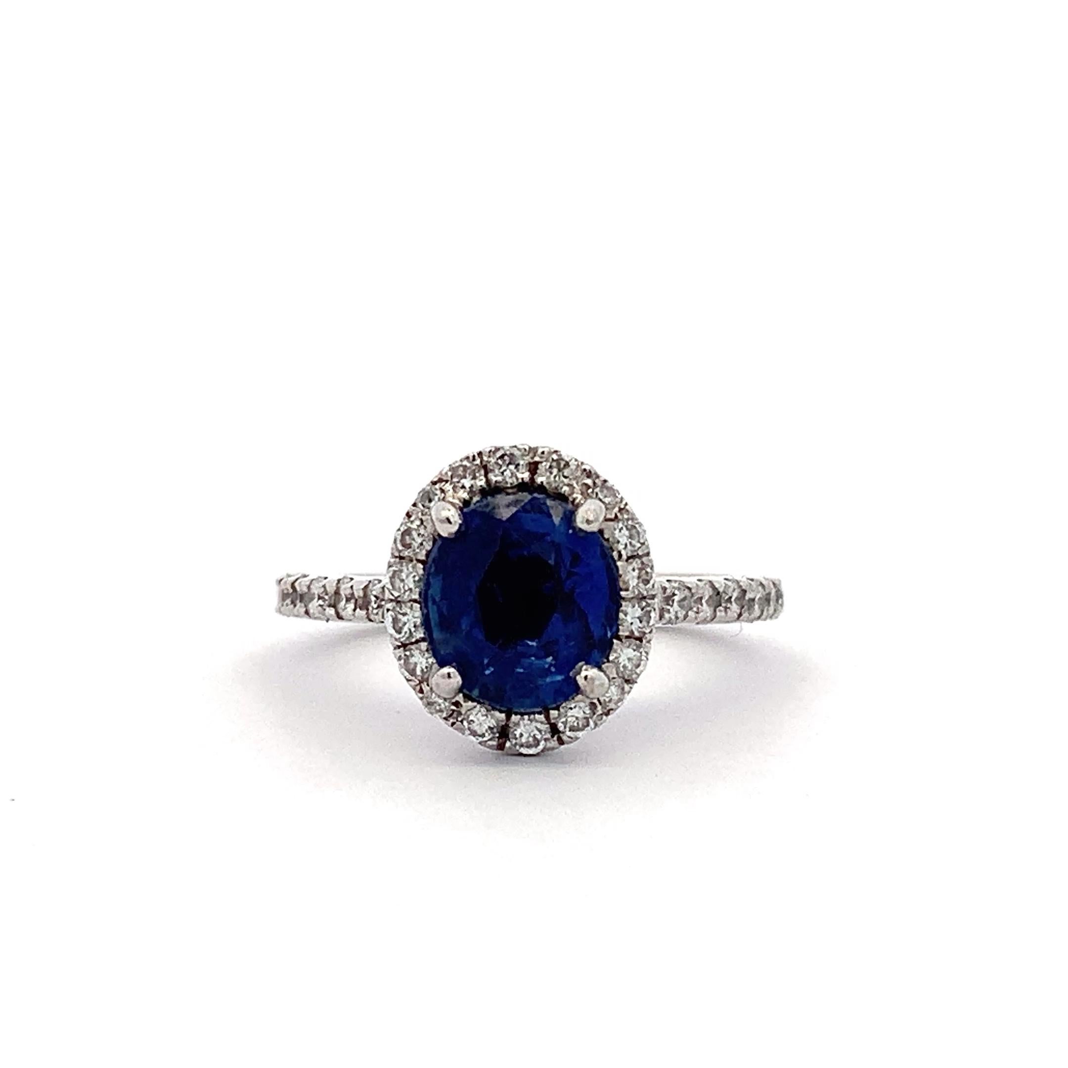 Oval Cut Sapphire and diamond halo engagement ring 18k white gold For Sale