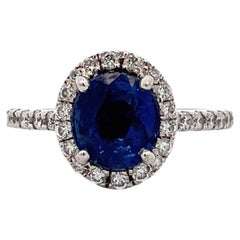 Sapphire and diamond halo engagement ring 18k white gold