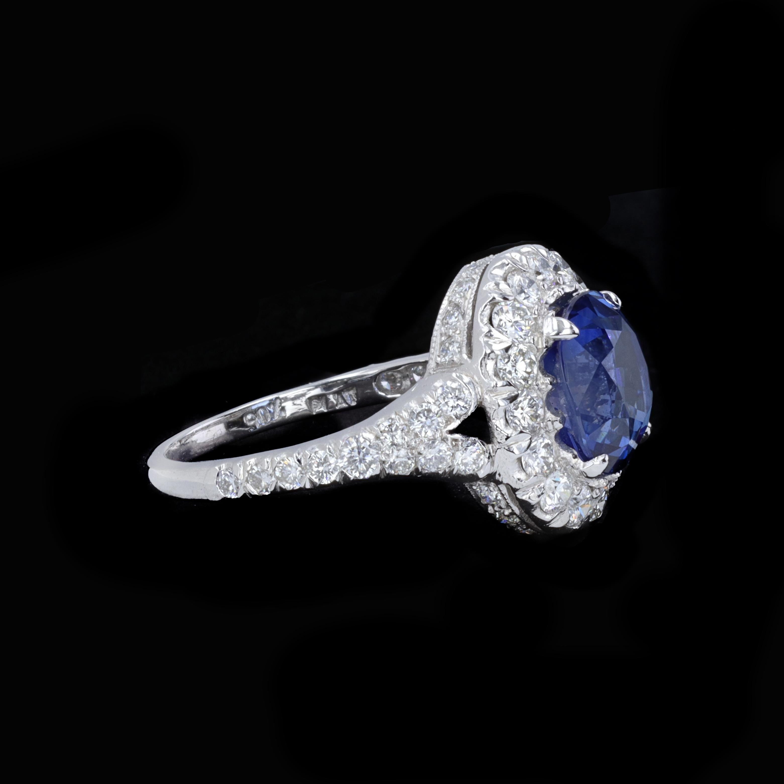 Oval Cut Sapphire and Diamond Halo Ring