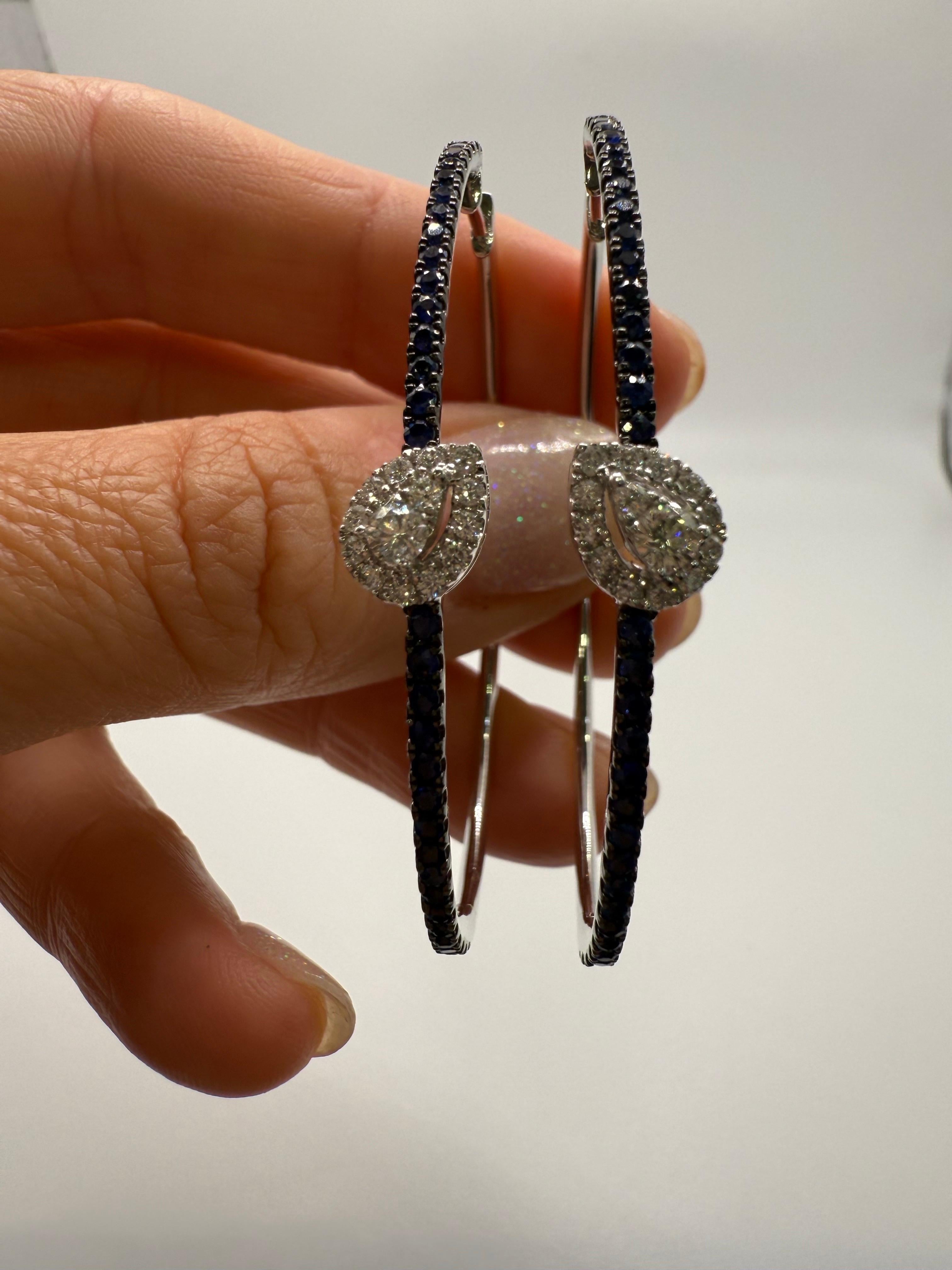 Un design straordinario con zaffiri blu scuro naturali e diamanti bianchi in oro 18Kt. 0,40 carati di gemme realizzate alla perfezione in un design a cerchio grande.

**Tutti gli oggetti lasciano la nostra sede con un certificato a nome