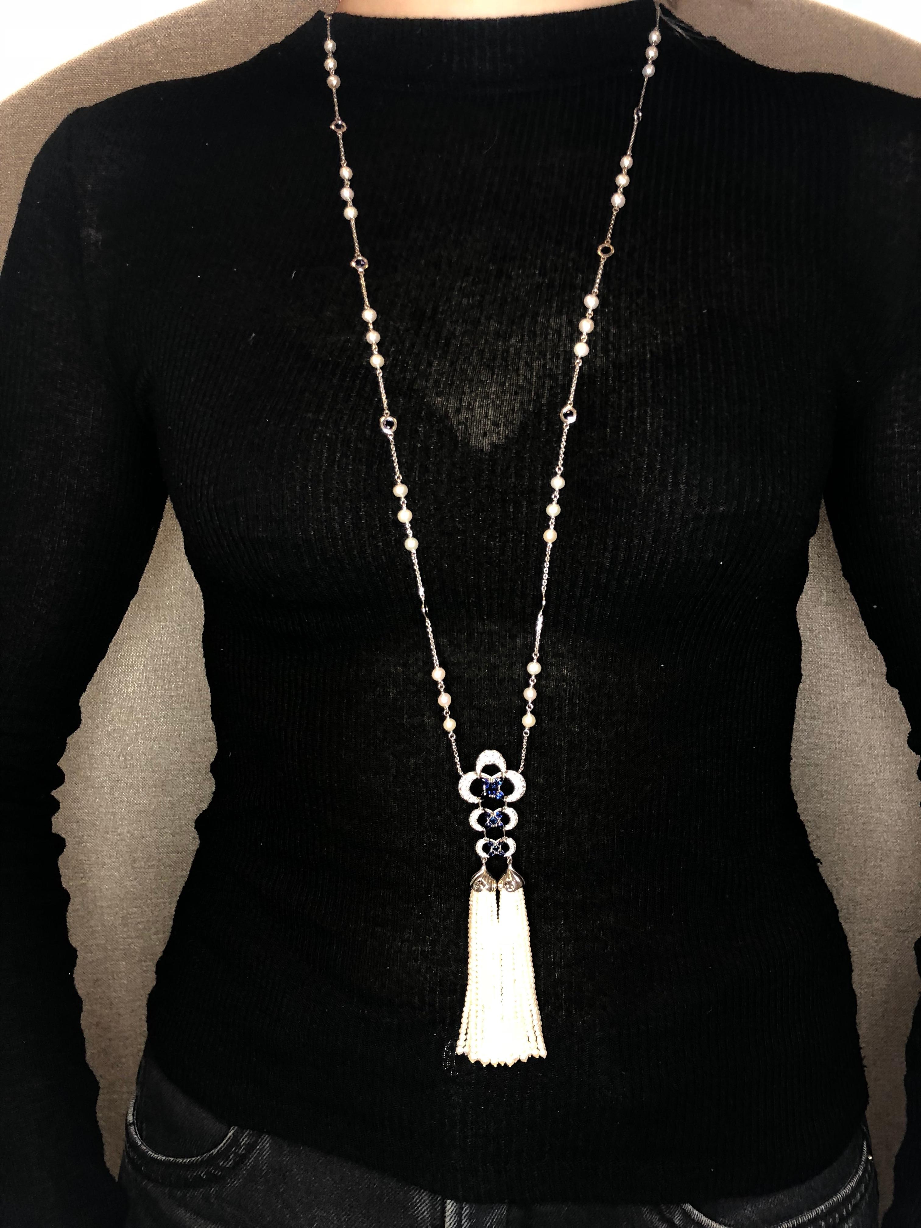 A beautiful Blue Sapphire and Diamond Lariat Necklace with Freshwater Pearl Tassel Handcrafted in 18k White Gold. This necklace features 1.80 carats of White Diamonds and 2.25 carats of Blue Sapphires with hand strung Freshwater Pearl Tassels. The