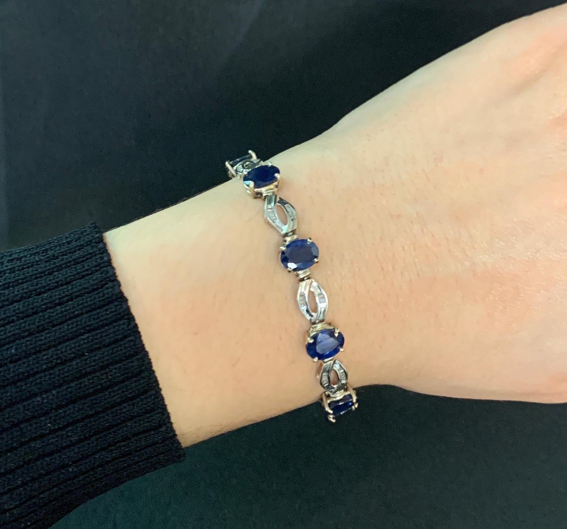 Sapphire and Diamond Link Bracelet

A white gold link bracelet, adorned with 10 oval sapphires and 88 square and triangle-cut diamonds.

Approximate sapphire weights: 14.19 carats
Approximate diamond weights: 1.00 carats
Approximate measurements: