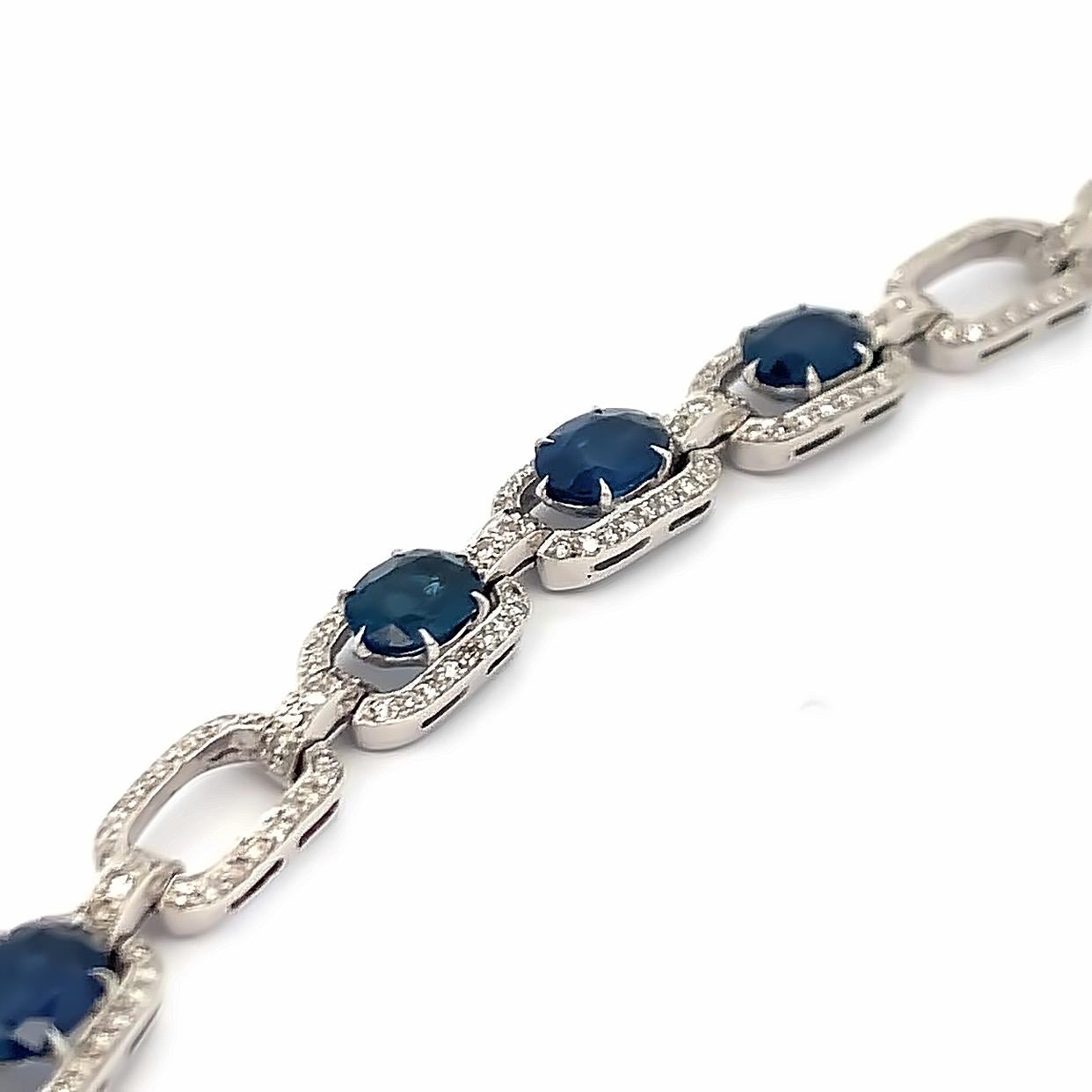 Sapphire and Diamond Link Bracelet

A white gold link bracelet adorned with oval and square cut sapphires and round cut diamonds. 

Approximate Sapphire Weights: 13.50 Carats
Approximate Diamond Weights: 3 Carats 
Approximate Length: 7.75
