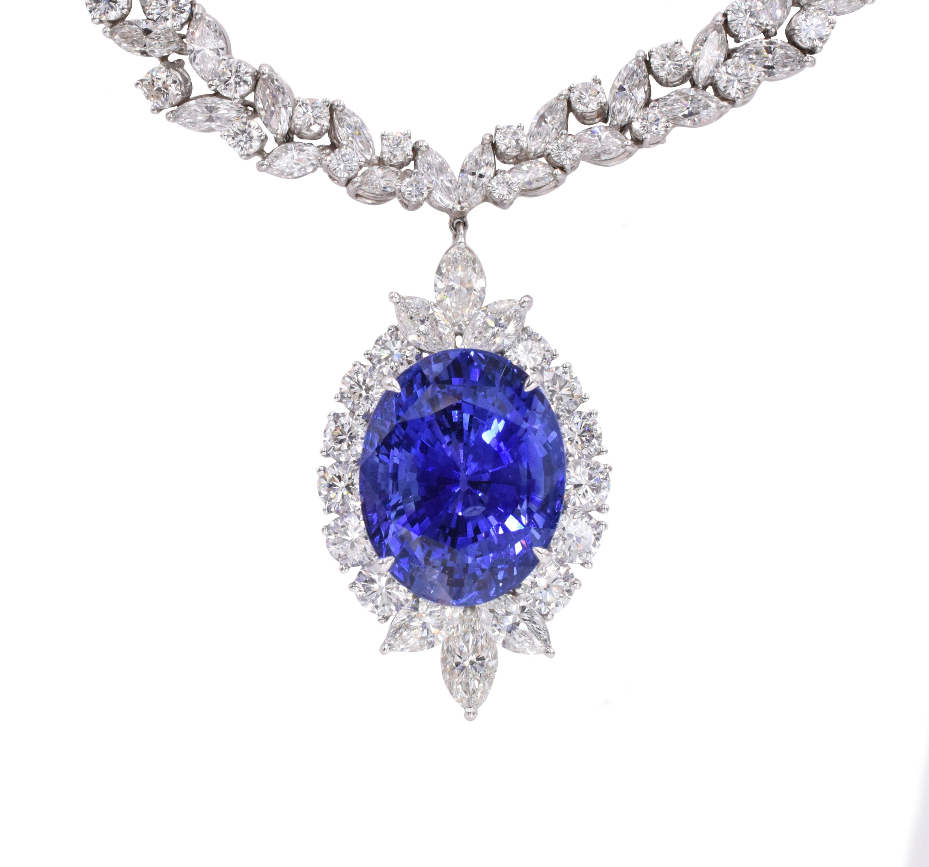 Ceylon Sapphire and Diamond Necklace and Earrings. This set of necklace has marquise, pear shaped, and round diamonds weighing approximately 36ct and a Oval shape sapphire of 50.14 carats, all set in platinum, The earrings have round diamonds