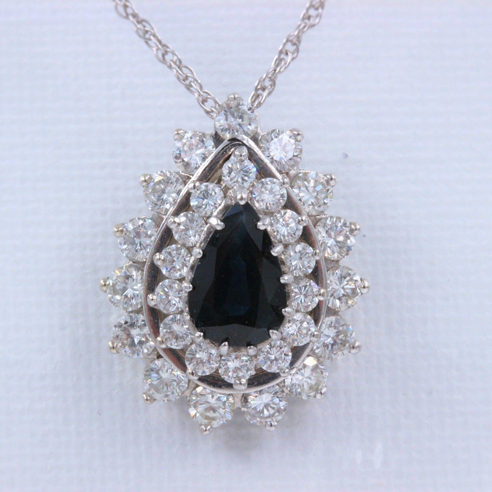 SAPPHIRE & DIAMOND PENDANT NECKLACE
Metal:  14K White Gold
Length:  15 Inches
Pendant Width:  .75 X .60 Inches X 9 MM Height
Total Carat Weight: 4.78 tcw
Center Stone:  Pear Shape Dark Blue Sapphire 2.44 cts
Diamonds:  29 Round Diamonds 2.34 tcw
