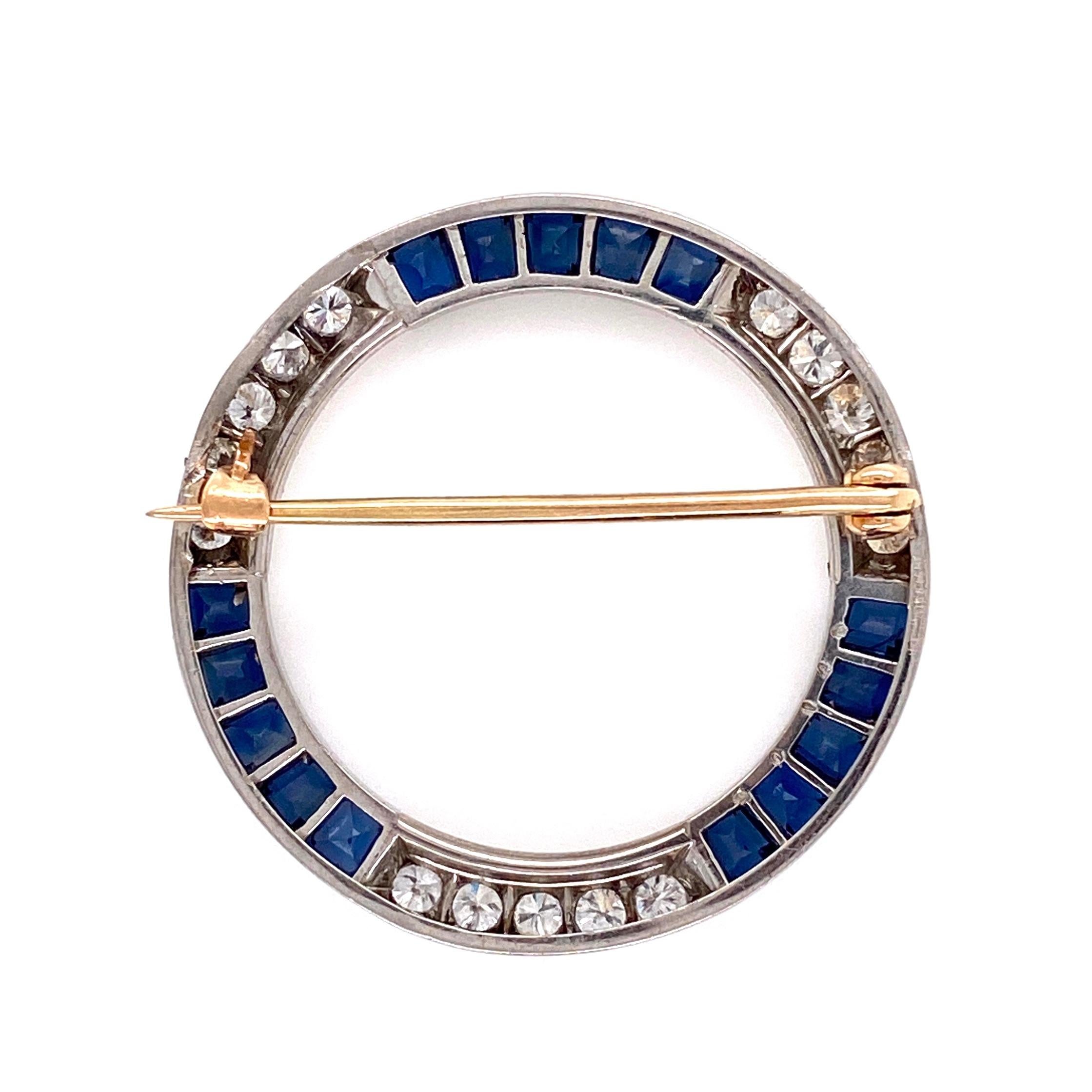 Beautiful Art Deco Sapphire and Diamond Platinum Circle Brooch securely Hand set with 15 French-cut Sapphires and 15 Diamonds, approx. 0.60tcw. Hand crafted Platinum mounting. Measuring approx. 1.25”in diameter. Add a touch of Glamor to any outfit!