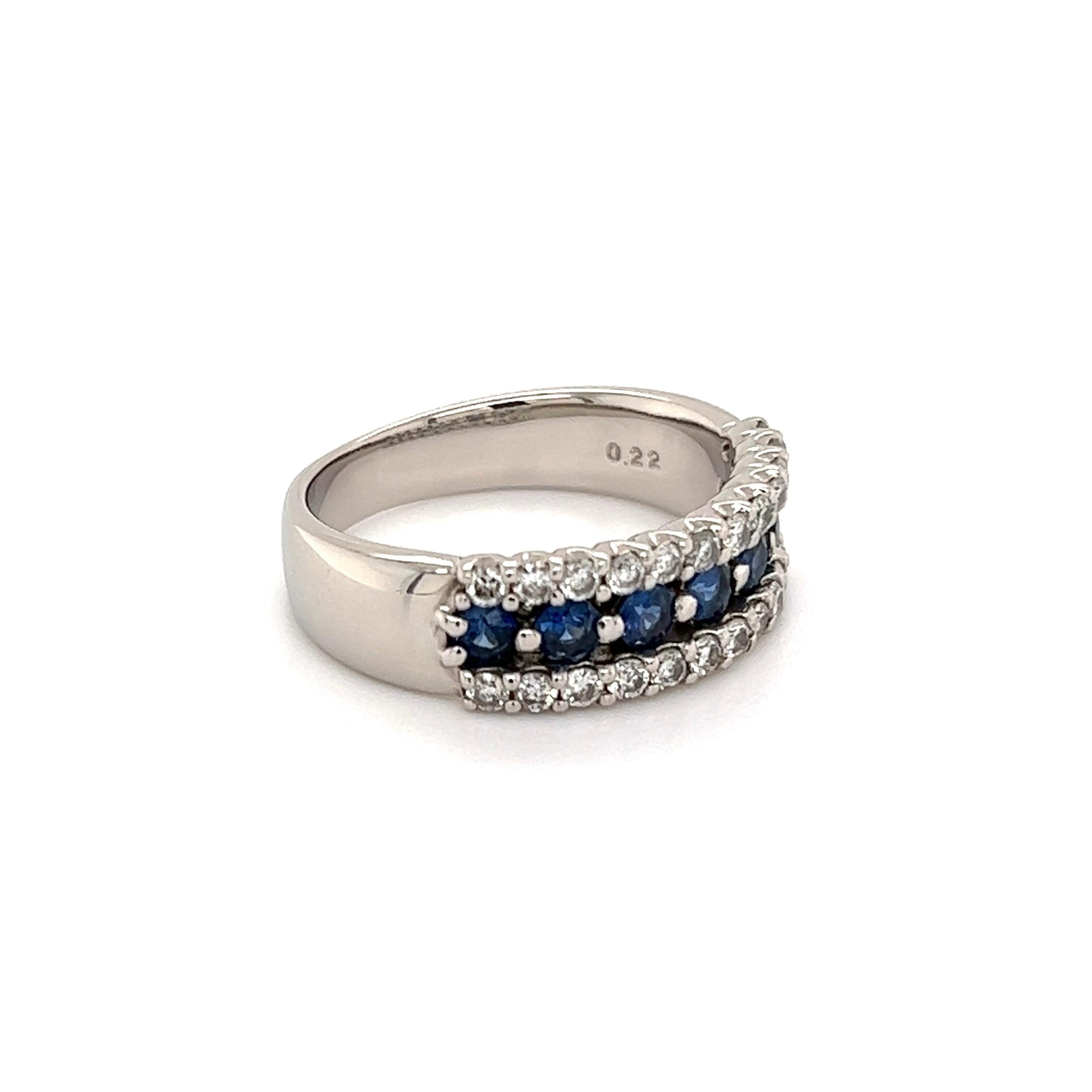 Simply Beautiful! Platinum Sapphire and Diamond Cocktail Band Ring. Centering securely Hand set Blue Sapphires, weighing approx. 0.55tcw and enhanced with Diamonds, weighing approx. 0.22tcw. Hand crafted in Platinum. Measuring approx. 0.82”l x