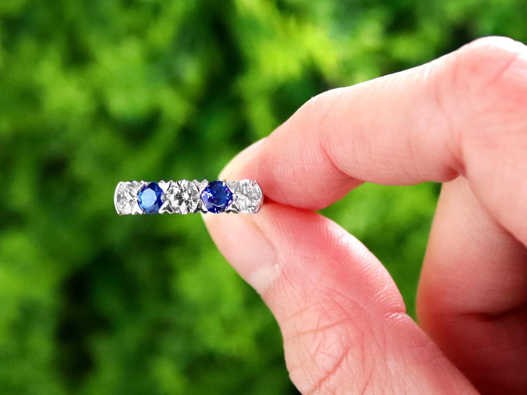 A stunning contemporary 0.62Ct blue sapphire, 0.95Ct diamond, and platinum five stone dress ring; part of our diverse gemstone jewelry collections.

This stunning, fine and impressive five stone sapphire and diamond ring has been crafted in