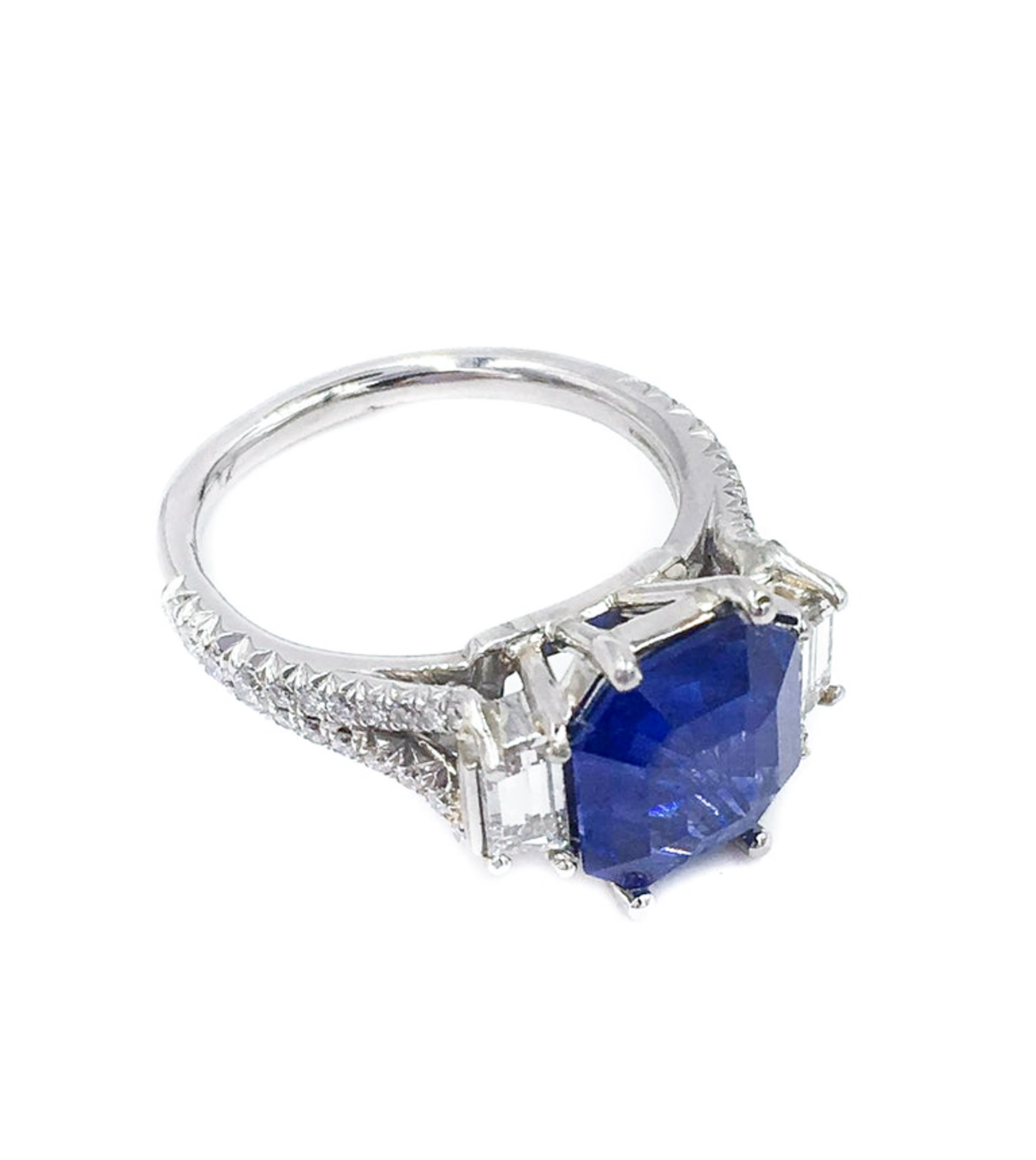 This is truly a special ring. The 4.01 carat is not your average sapphire, it is a modified octagonal cut making it distinct as well as versatile. 
The beautiful cornflower blue will pop from anyone's hand. 
Expertly set and handcrafted in platinum,