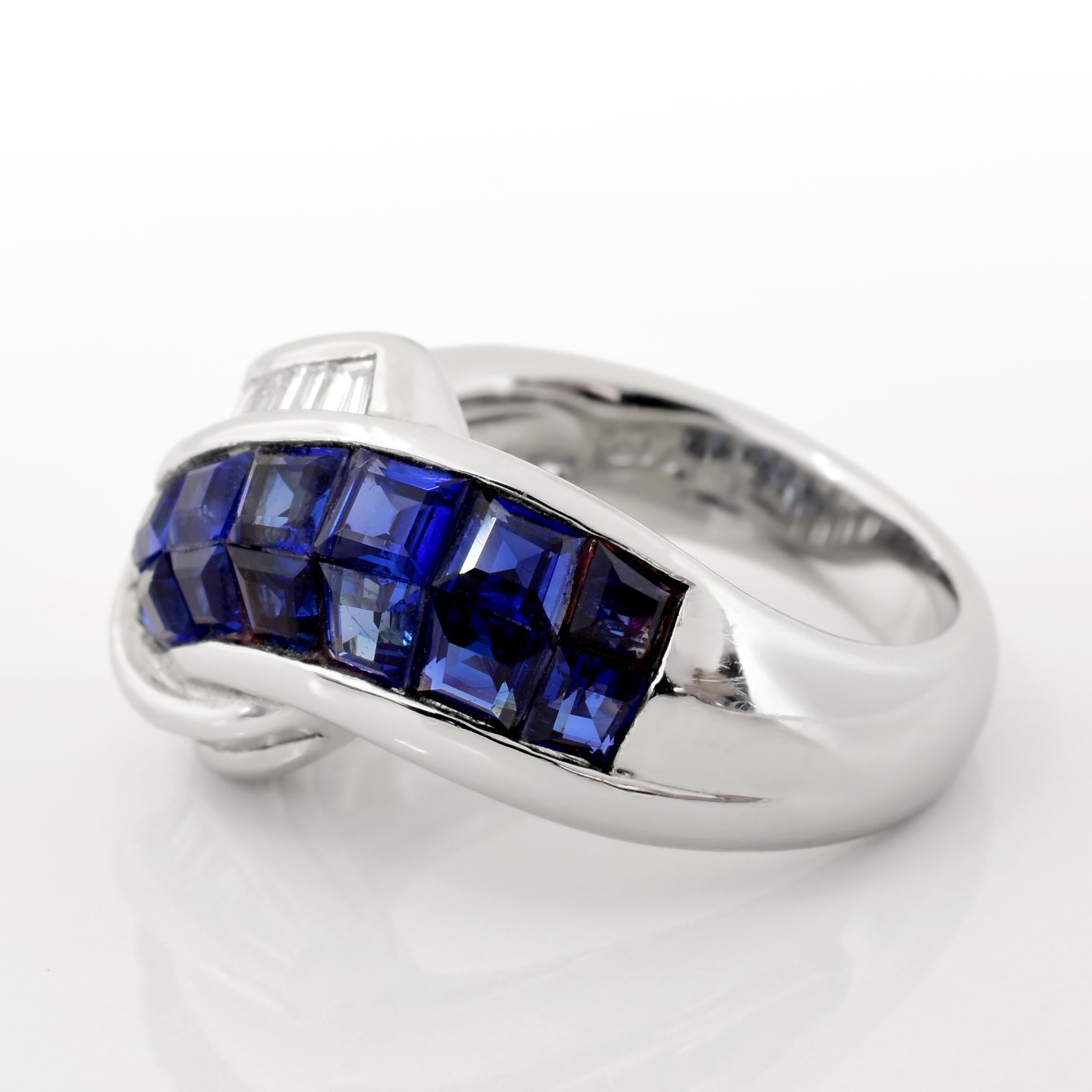 A vintage platinum ring with an overlapping diamond and sapphire design. There are approximately 2.49 carats of French cut sapphires and 1.10 carats of baguette cut diamonds.