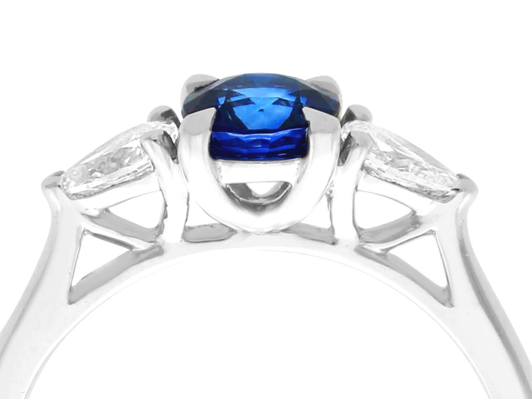 Round Cut Sapphire and Diamond Trilogy Engagement Ring in Platinum For Sale