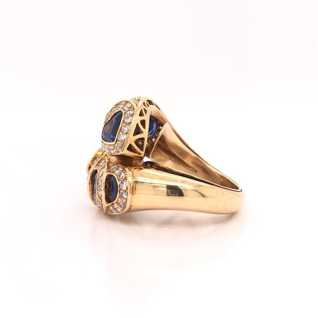 Heart and Circle Shapes One on Top of Each Other Setting  18K Yellow Gold 
Sapphires and Diamonds
Sapphire Weight: 7.5ct 
Diamond Weight: 2ct twt
Color: D
Clarity: VS1 
Ring Size: 6 (Sizable)

Good Condition!
