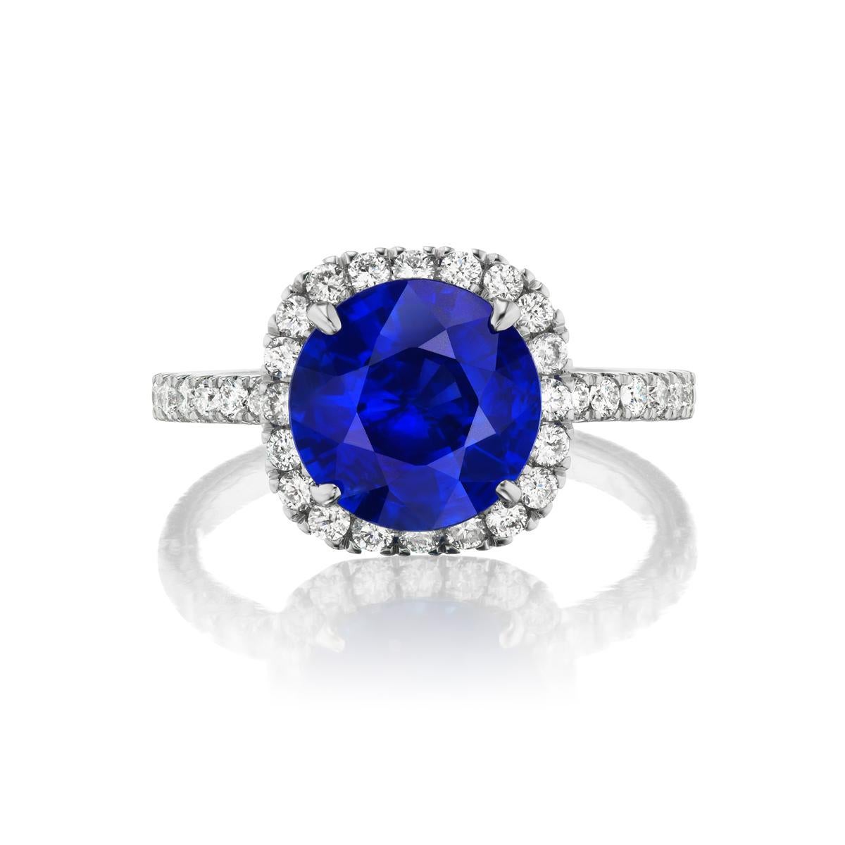 SAPPHIRE AND DIAMOND RING
A dazzling blue sapphire in a prong setting is surrounded by a glimmering diamond halo. The shoulders of the ring are also adorned with diamond accents for added sparkle. Crafted in 14k white gold, this round sapphire halo
