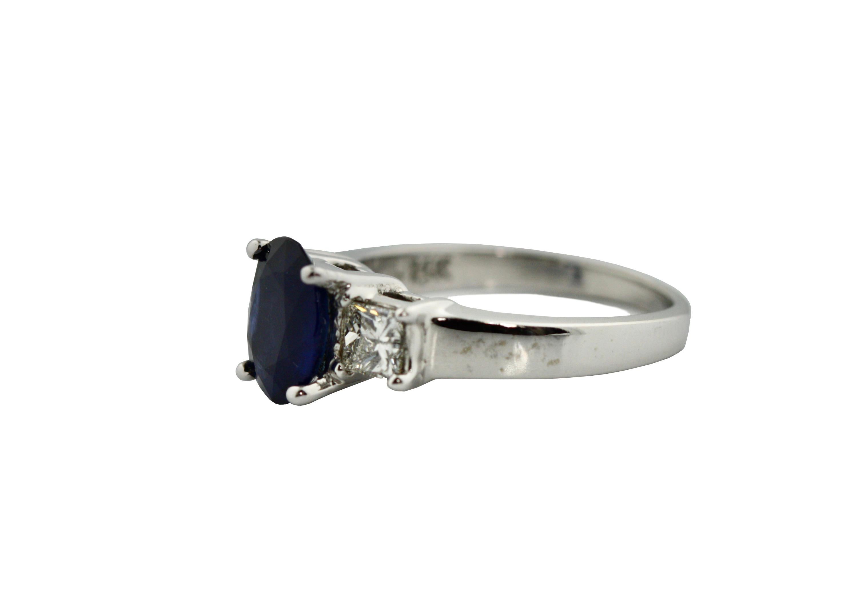 
Sapphire and Diamond Ring 
The oval-shaped sapphire weighing approximately 1.97 carats, flanked by square diamonds weighing approximately .70 carats
mounted in 14kt white gold 
5 grams (gross) , size 6 1/4 