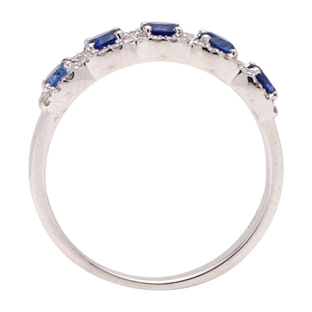 This halfway around Sapphire and Diamond ring is a gorgeous addition to all jewelry collections. This ring has 5 royal blue sapphires totaling 0.86 carats and 52 round VS2, G color diamonds surrounding the sapphires totaling .23 carats. This ring is