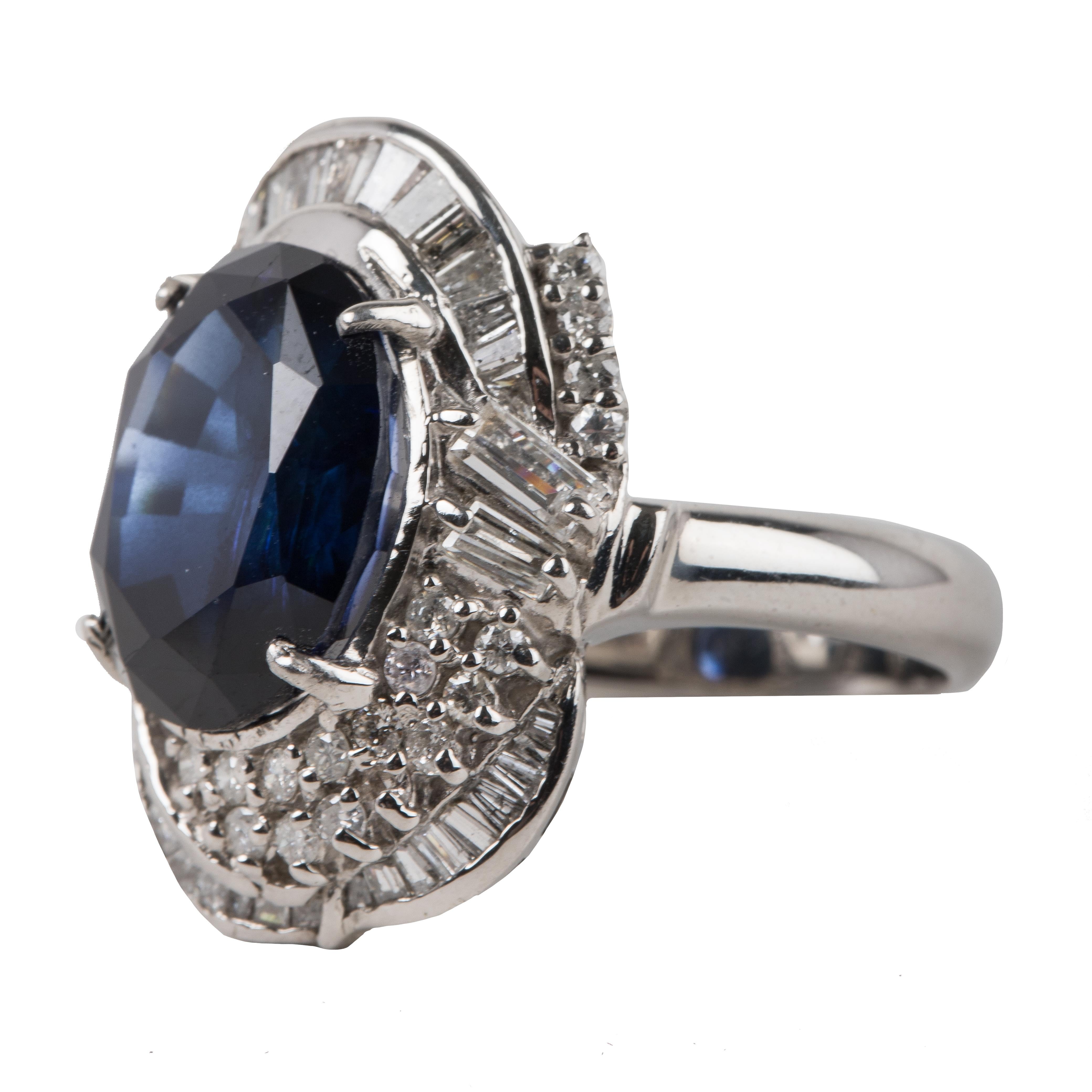 Oval Cut Sapphire - appx 9 carats
Round cut and baguette diamond halo surrounding beautiful sapphire stone
