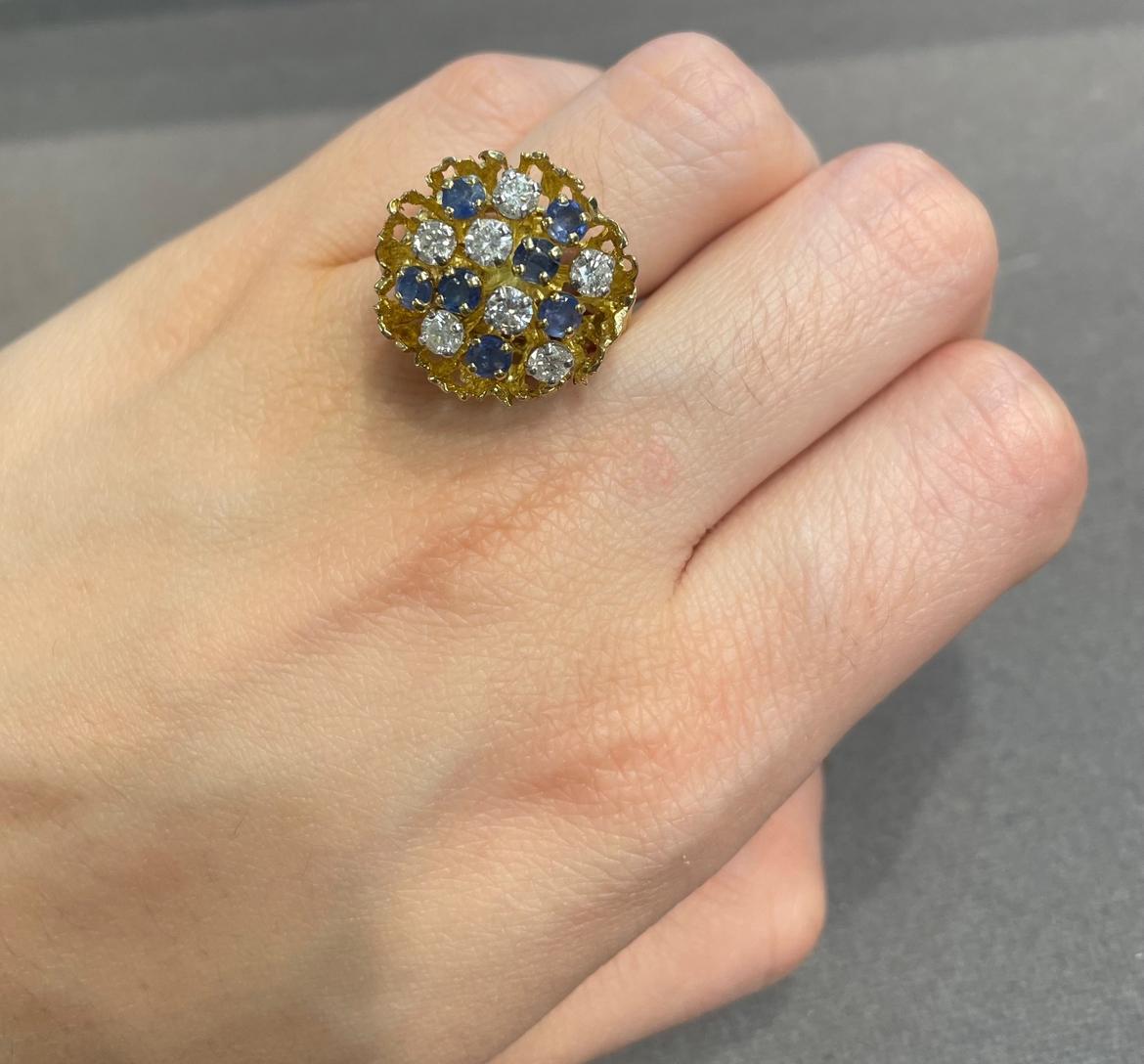 Sapphire and Diamond Flower Bouquet Ring 

A yellow gold ring set with round cut sapphires and diamonds

Approximate Sapphire Weight:  1.00 carat
Approximate Diamond Weight: 1.03 carats
Approximate Weight: 10 grams
Ring Size: 6
Complimentary
