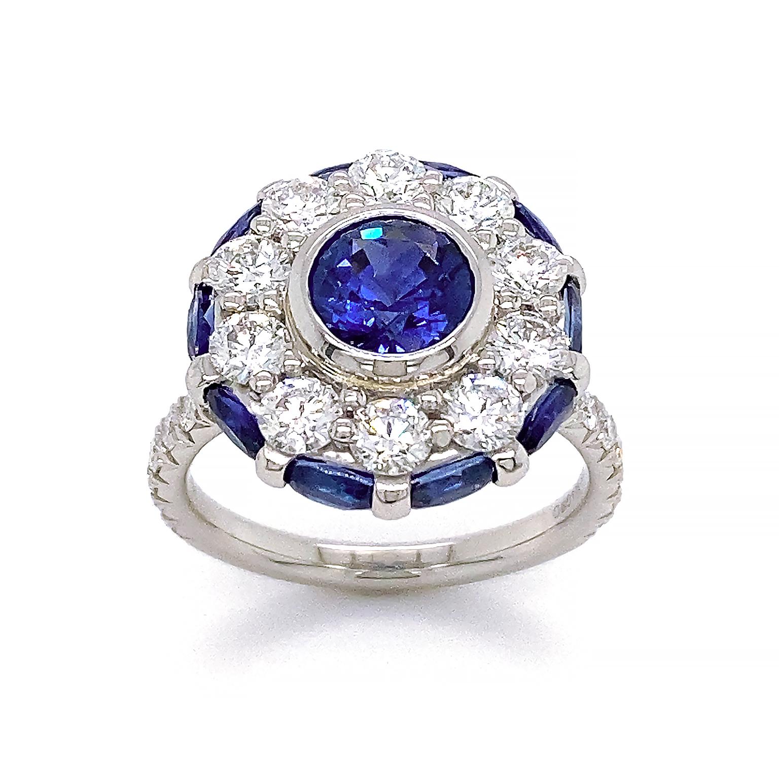 Contemporary Platinum Sapphire and Diamond Halo Ring For Sale