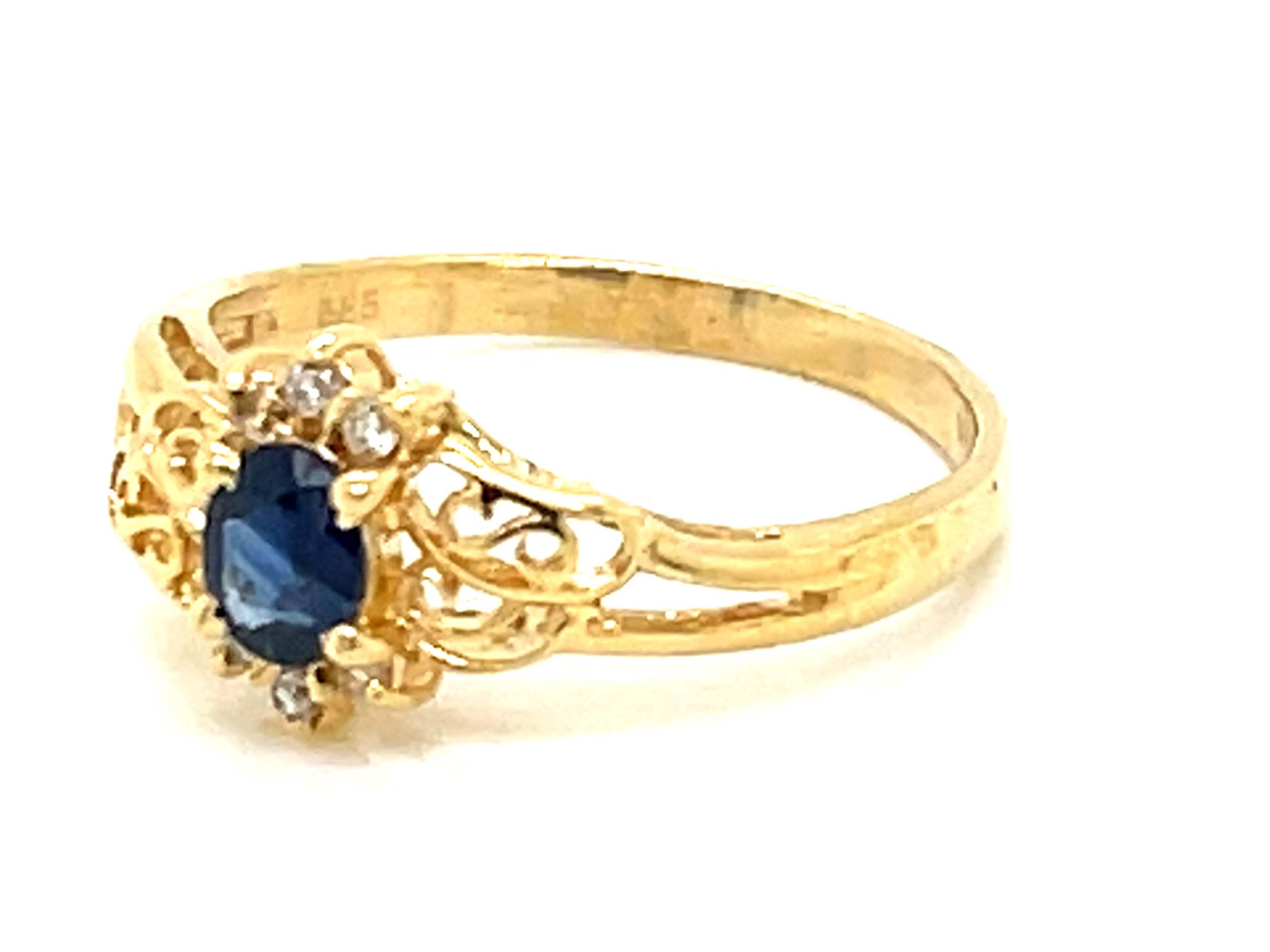 Marquise Cut Sapphire and Diamond Ring in 14k Yellow Gold