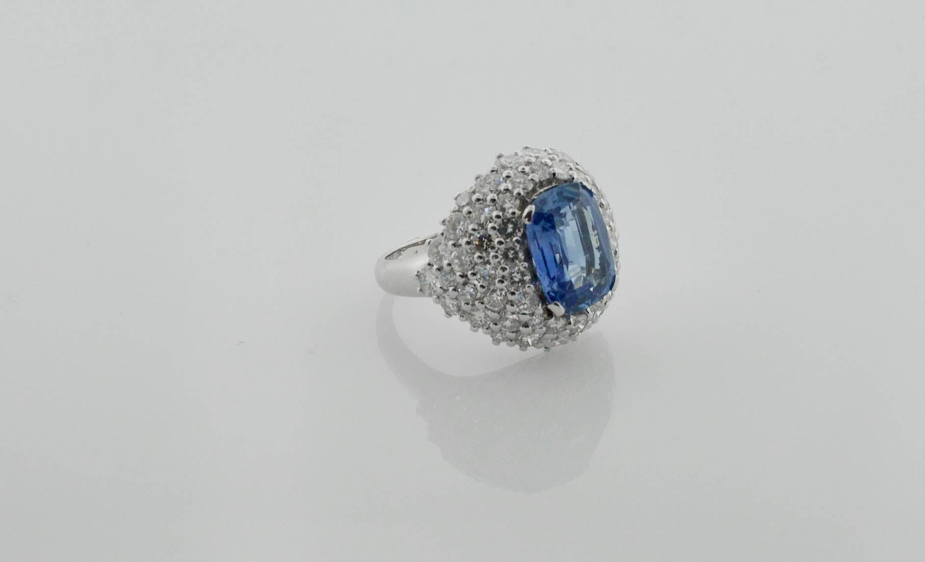 Sapphire and Diamond Ring in 18k Gold Circa 1940's
A Pastel Blue Cushion Cut Sapphire weighing 5.92 
Fifty Eight Round Brilliant Cut Diamonds weighing 6.00carats approximately color GH Clarity VS1-SI
The Setting Work on the Stones is Immaculate   