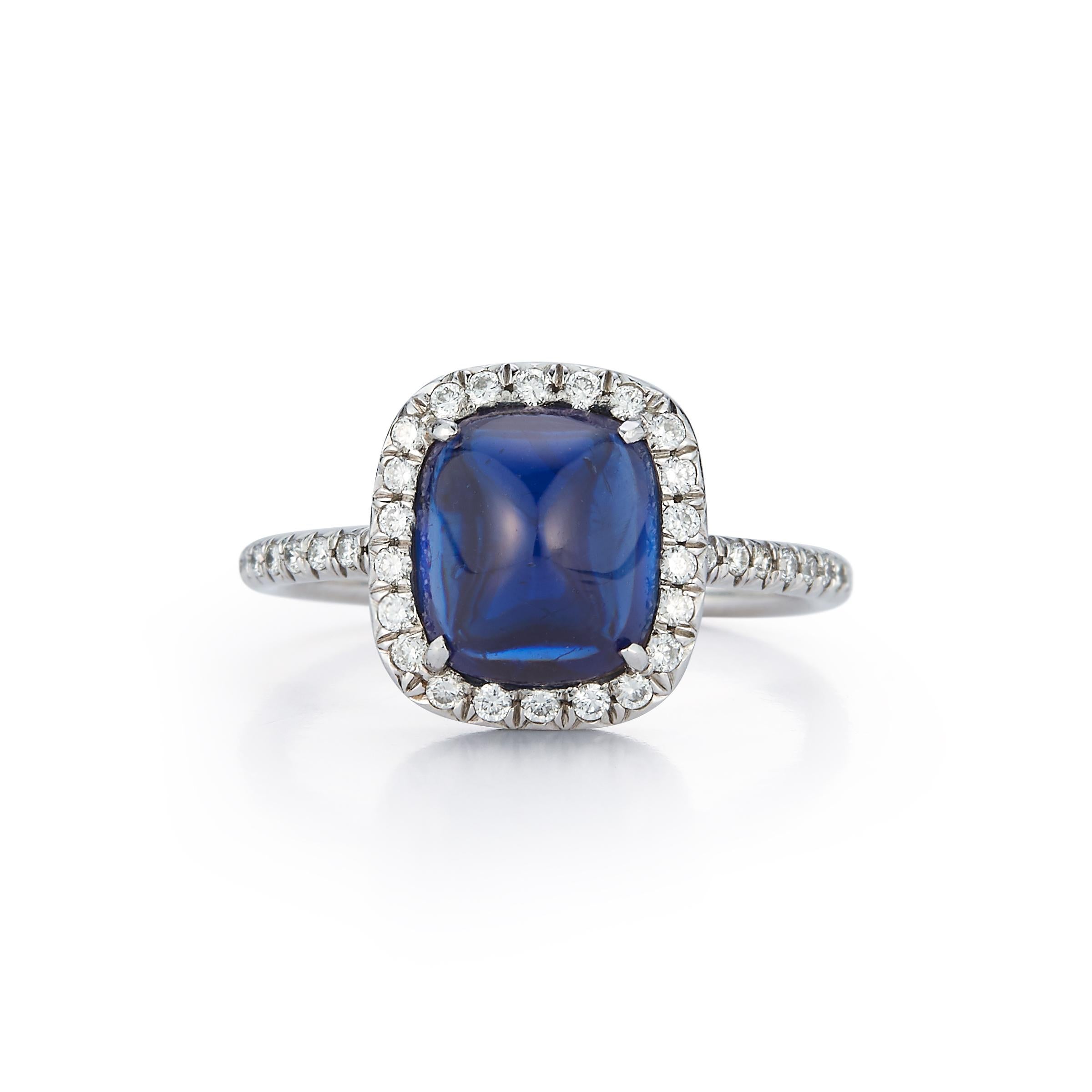 Estate Jewelry Curated by Parulina- This beautiful ring features a 3.44ct cab cut blue sapphire surrounded by .50ct of diamonds. Set in 18K white gold. Size 6.5

Metal:18K White Gold
Gemstone Carat: 3.44ct sapphire
Diamond Carat: 0.50ct