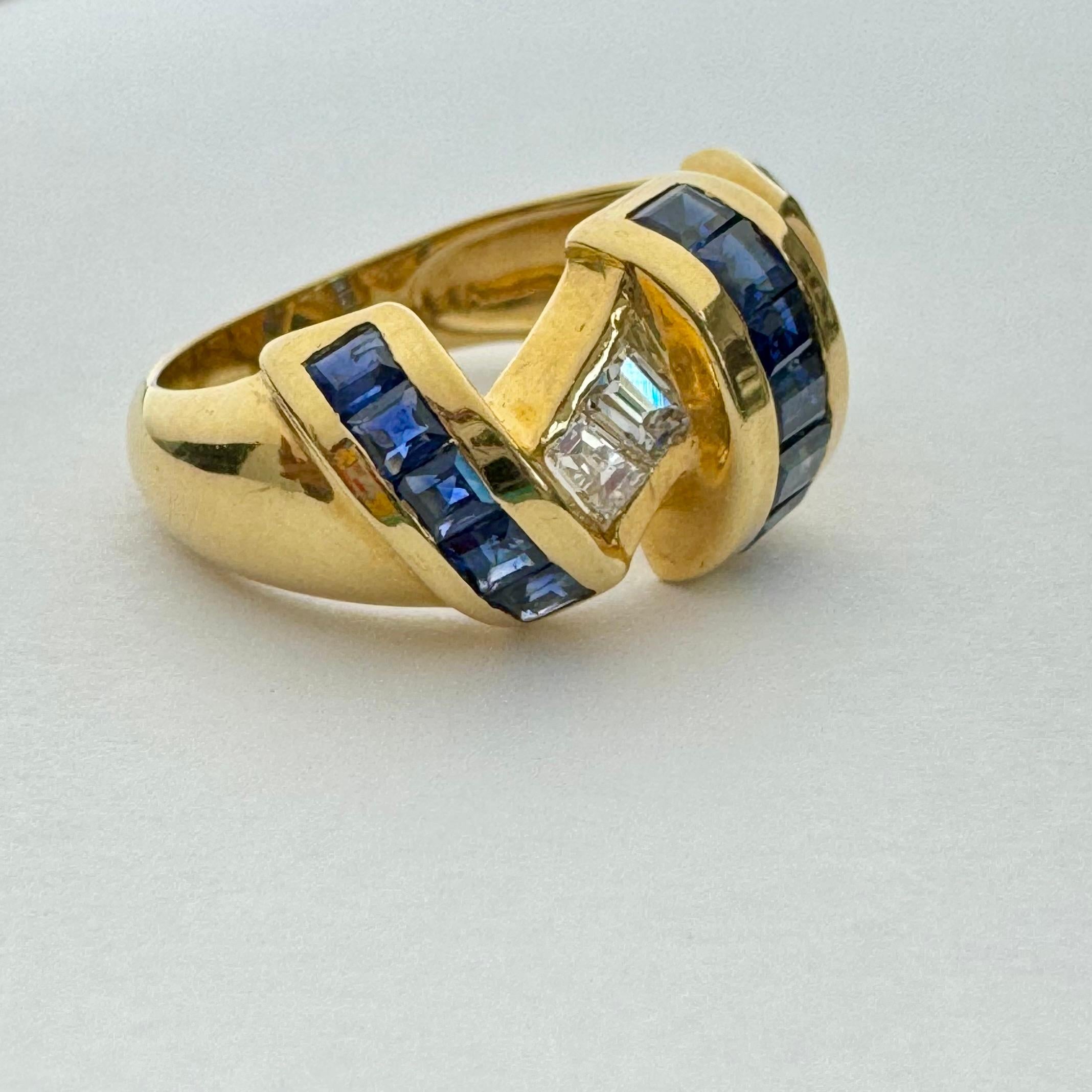 Elegant and unique sapphire and diamond ring, set in sold 18k yellow gold.
The ring's ribbon design is created with expertly channel set of brilliant blue step cut sapphire and sparkling white diamonds,
The sapphires weigh approximately 2.10cttw and