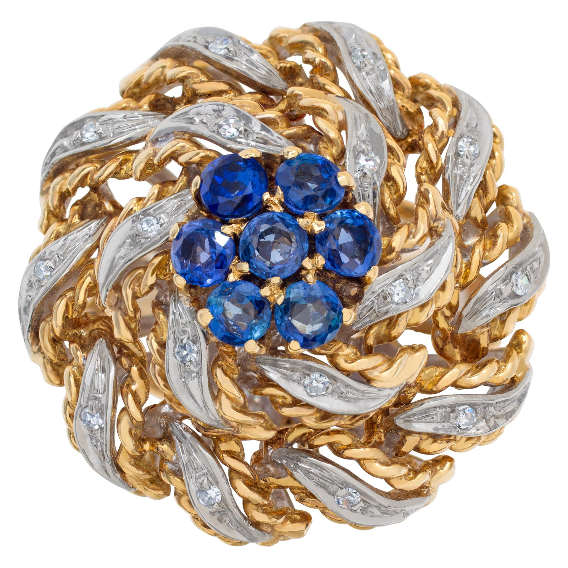 Flower sapphire and diamond ring in twisted 18k white and yellow gold. Size 6.5

This Sapphire ring is currently size 6.5 and some items can be sized up or down, please ask! It weighs 7.8 pennyweights and is 18k.