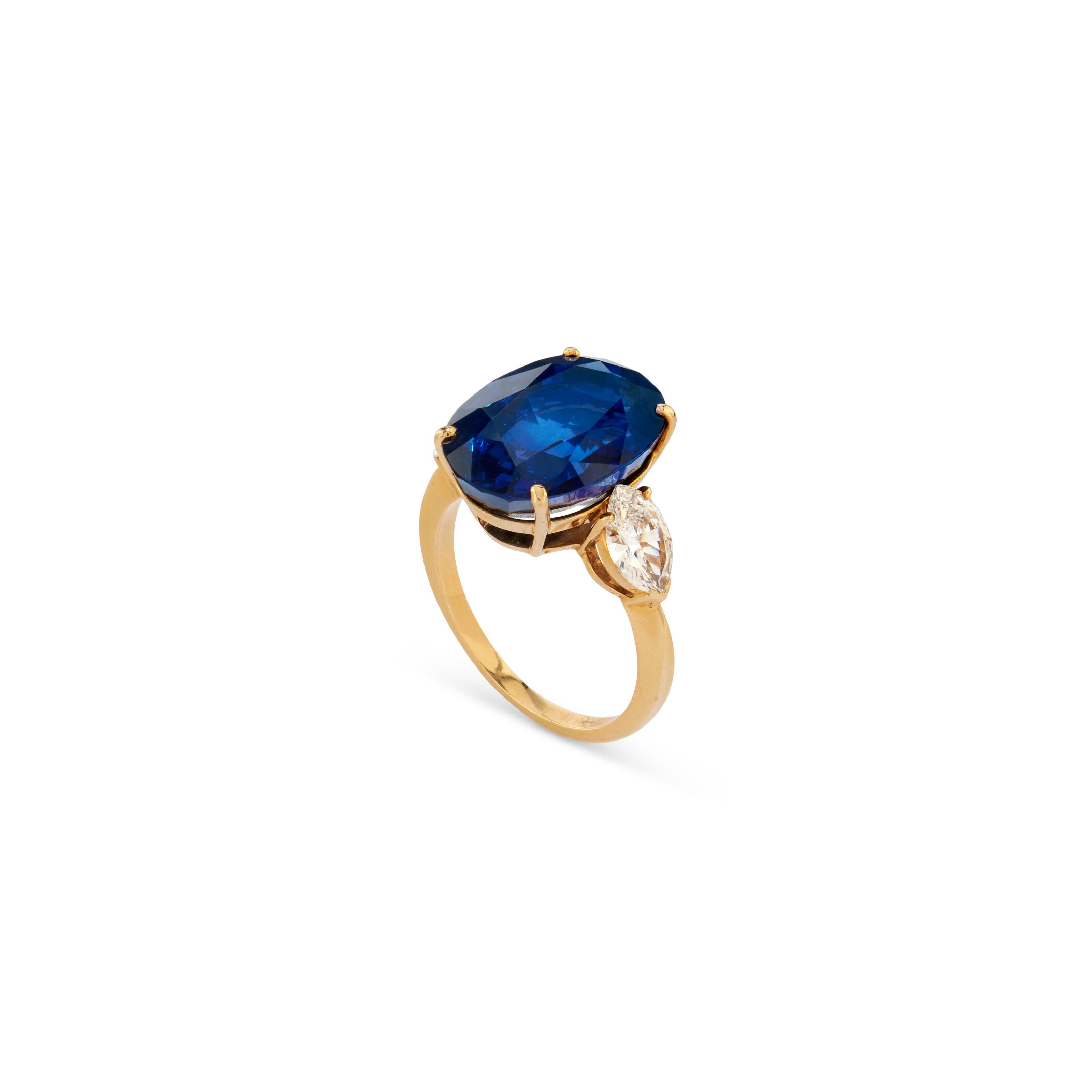 Oval-shaped sapphire weighing approximately 11.00 Carats flanked by marquise-shaped diamonds weighing 1.10 Carats

Heated Sapphire

Set in 18 Karat Yellow Gold