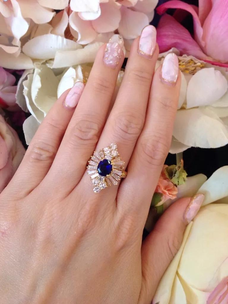 Sapphire and Diamond Ring with Baguettes and Rounds

Sapphire and Diamond Ring features an Oval Blue Sapphire surrounded by 8 Round Brilliant cut Diamonds and 14 Tapered Baguette Diamonds in a Ballerina style setting in 18k Yellow Gold.

The