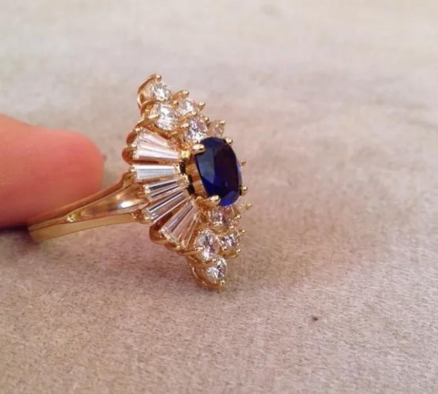 Oval Cut Sapphire and Diamond Ring with Baguettes and Rounds in 18k Yellow Gold For Sale