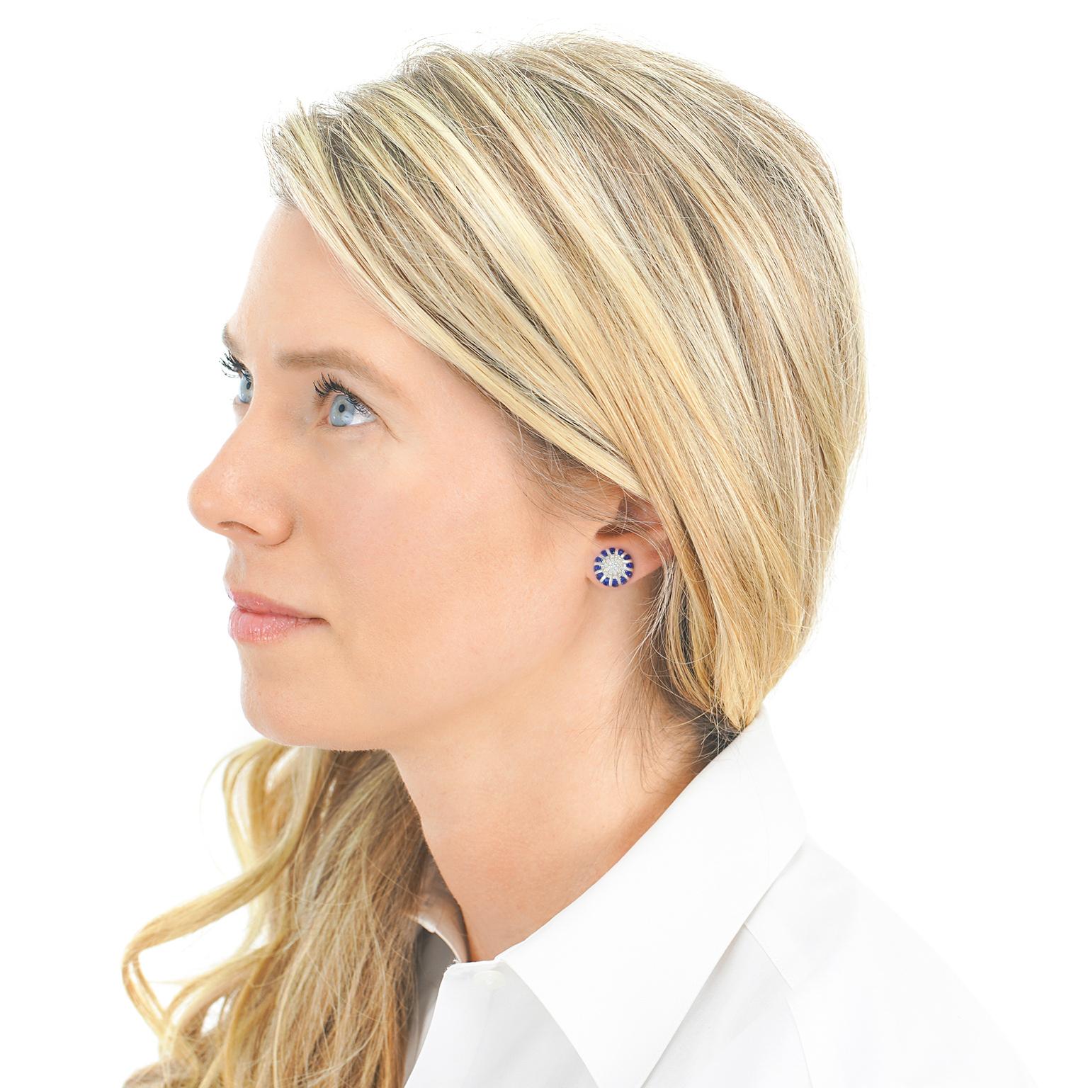Circa 2000s, 18k, by Spark Creations, New York. These stunning earrings from Spark Creations feature lush cornflower blue sapphires surrounding a brilliant white diamond (G color, VS clarity) center. Perfect for cocktail attire or everyday wear, the