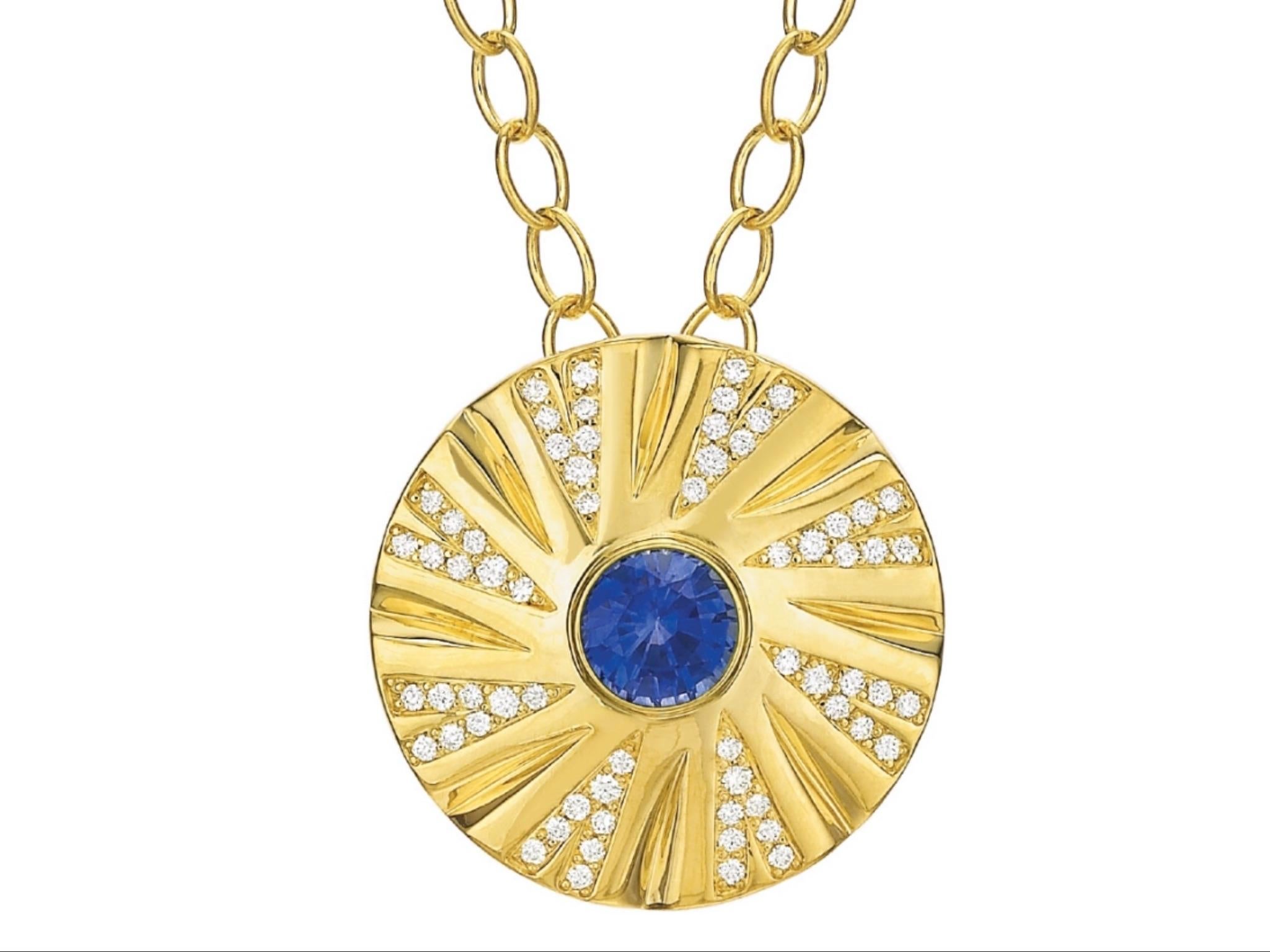 1.07 carat round Sapphire and Diamond Necklace set in Andrew Glassford's Shazam Series Style. Diamonds in a V shape radiate from the Sapphire center stone and are .35 ctw of GH VSI round brilliants. The chain is 18k Yellow Gold link, 3mm wide and 18