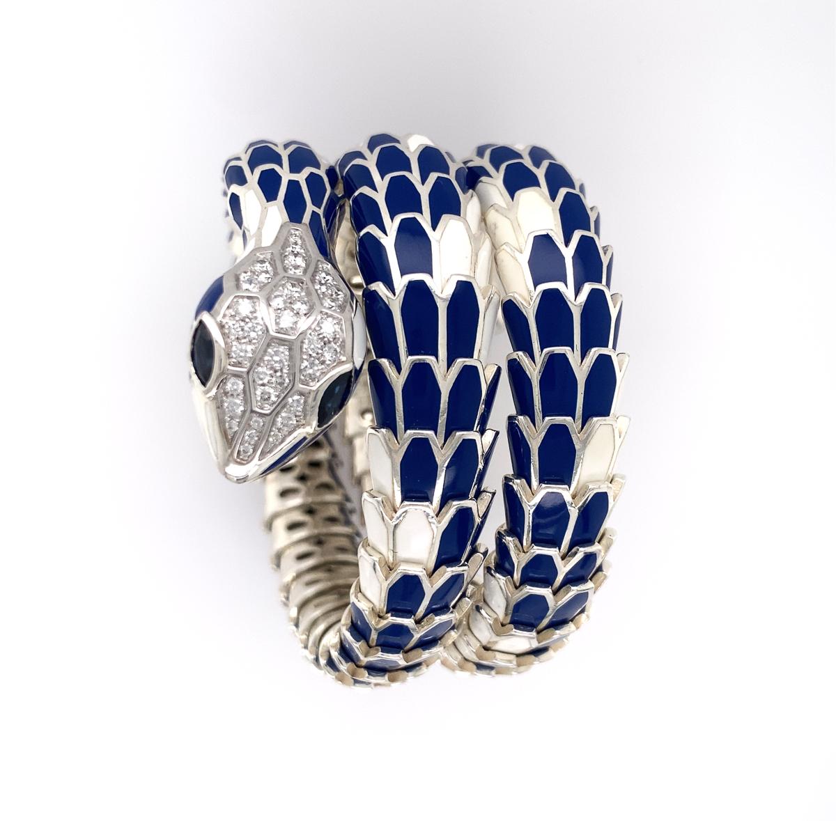 Very beautiful snake, the scales applied with blue and white enamel, the eyes set with marquise-shaped sapphires, further enhanced with pavé-set round brilliant-cut diamonds approx. 1.10 cts and 0.55 cts of sapphires; Head and tail are mounted in