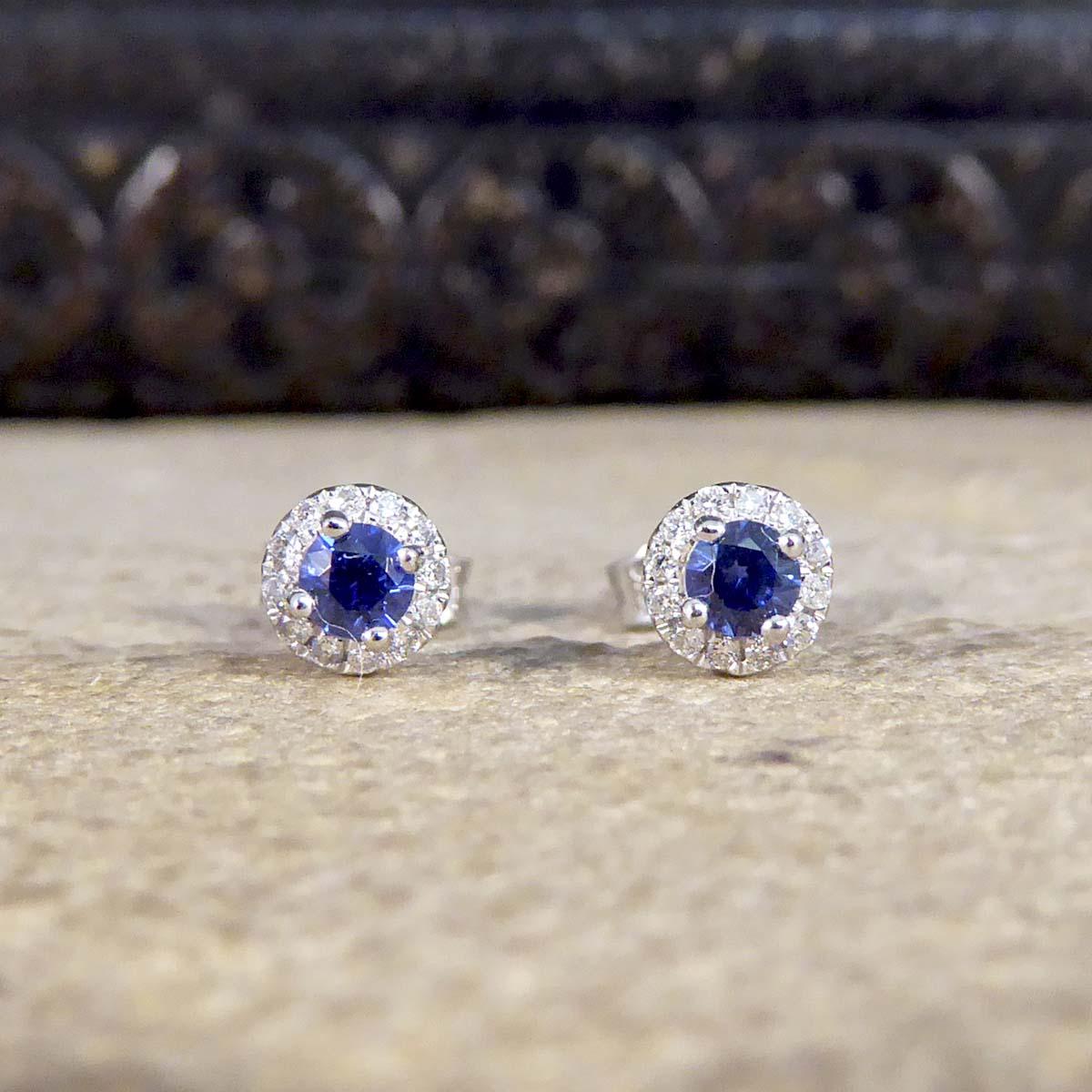 A lovely piece that will stand the test of time and never go out of style. These beautiful Sapphire and Diamond stud earrings have been crafted in a target style with a Sapphire in the centre surrounded by 12 equally sized Diamonds. Together both