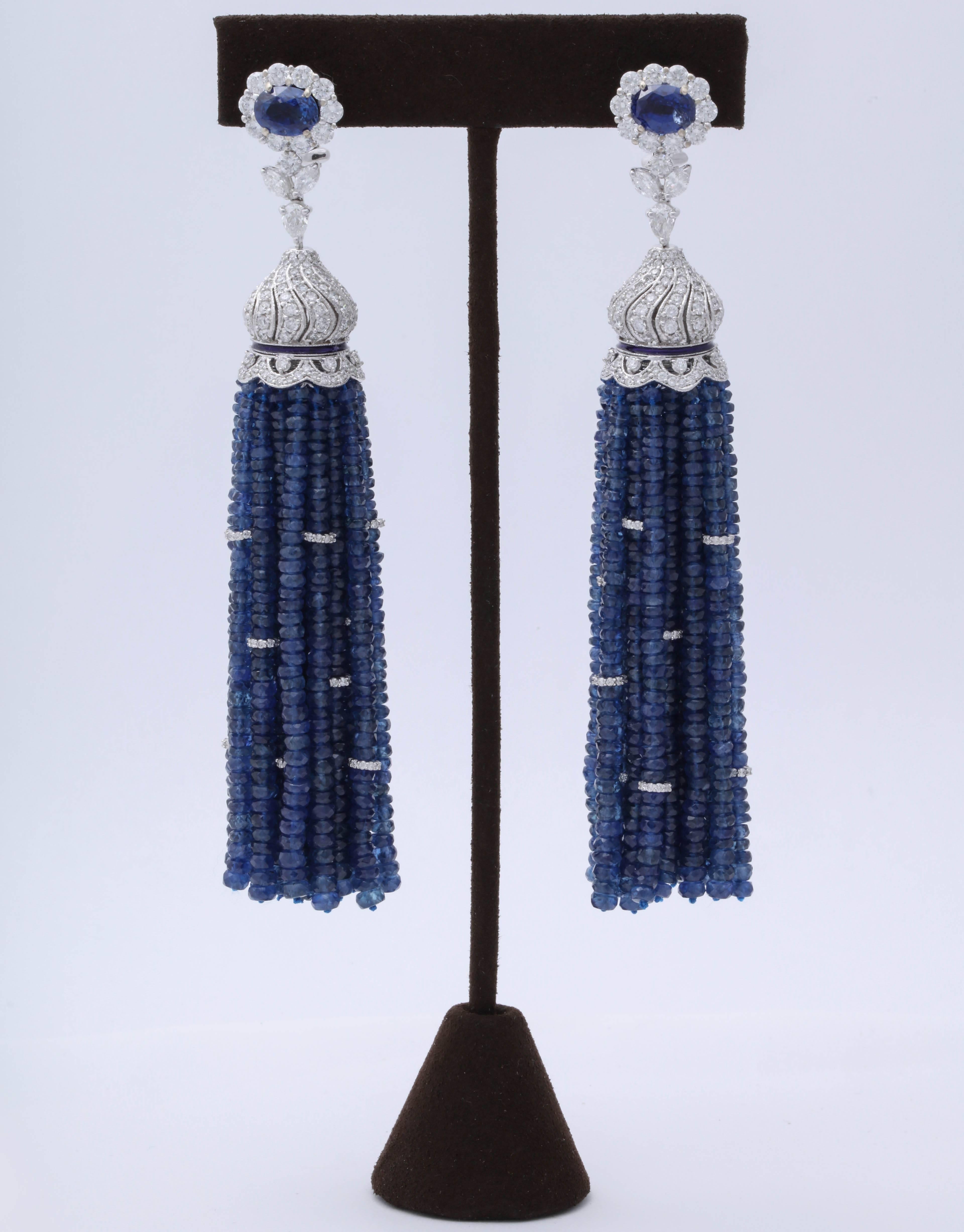 
Fabulous statement earrings! 

Over 300 carats of fine blue sapphire!   9.85 carats of diamonds!

Just over 4 inches in length 

18k white gold 

A one of a kind earring that can be worn casually or to a black tie affair. 
