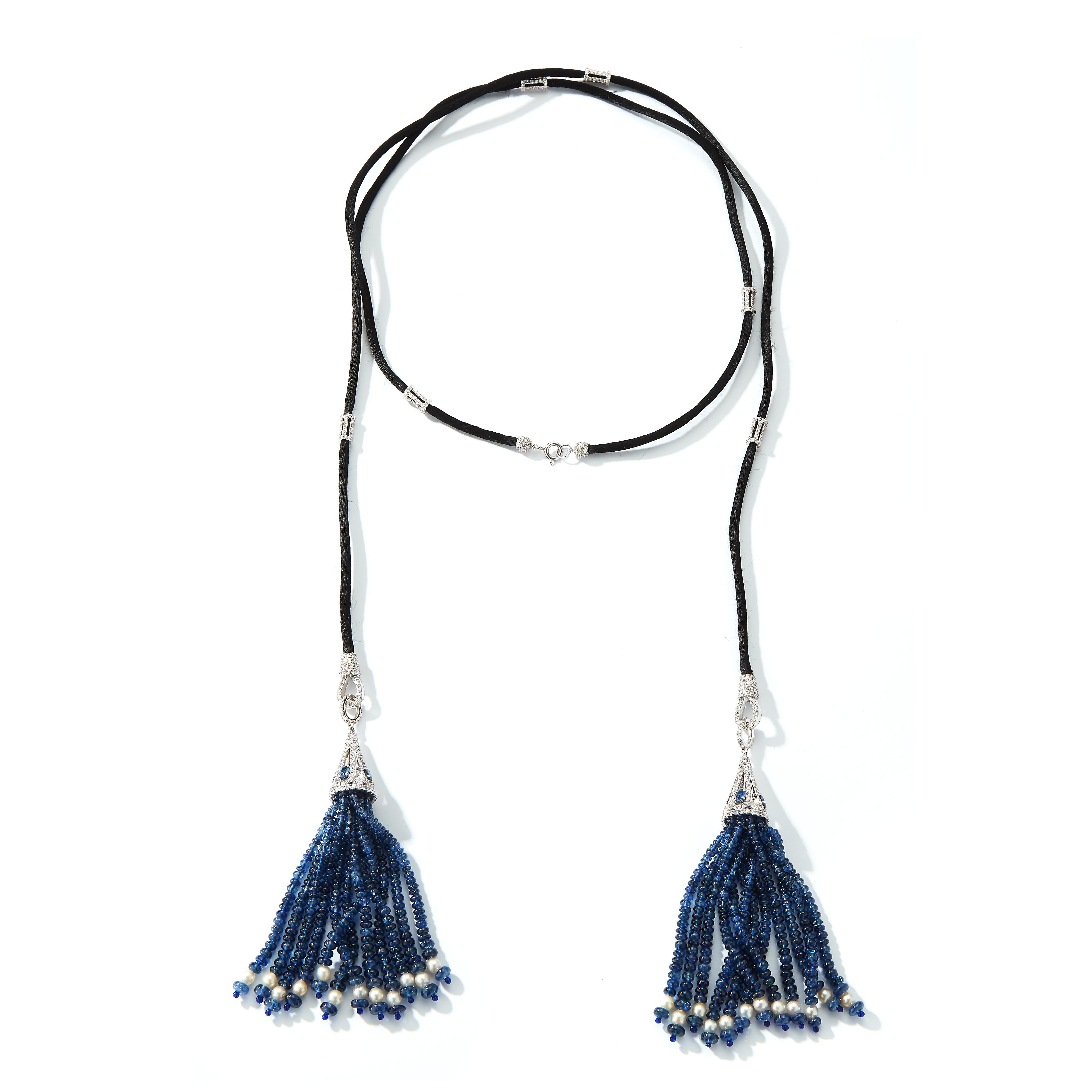Sapphire & Diamond Tassel Lariat Necklace with diamond spacers set on silk

Approximately 7.07 carats of diamonds
Approximately 144.88 carats of sapphires

Measurements: 42