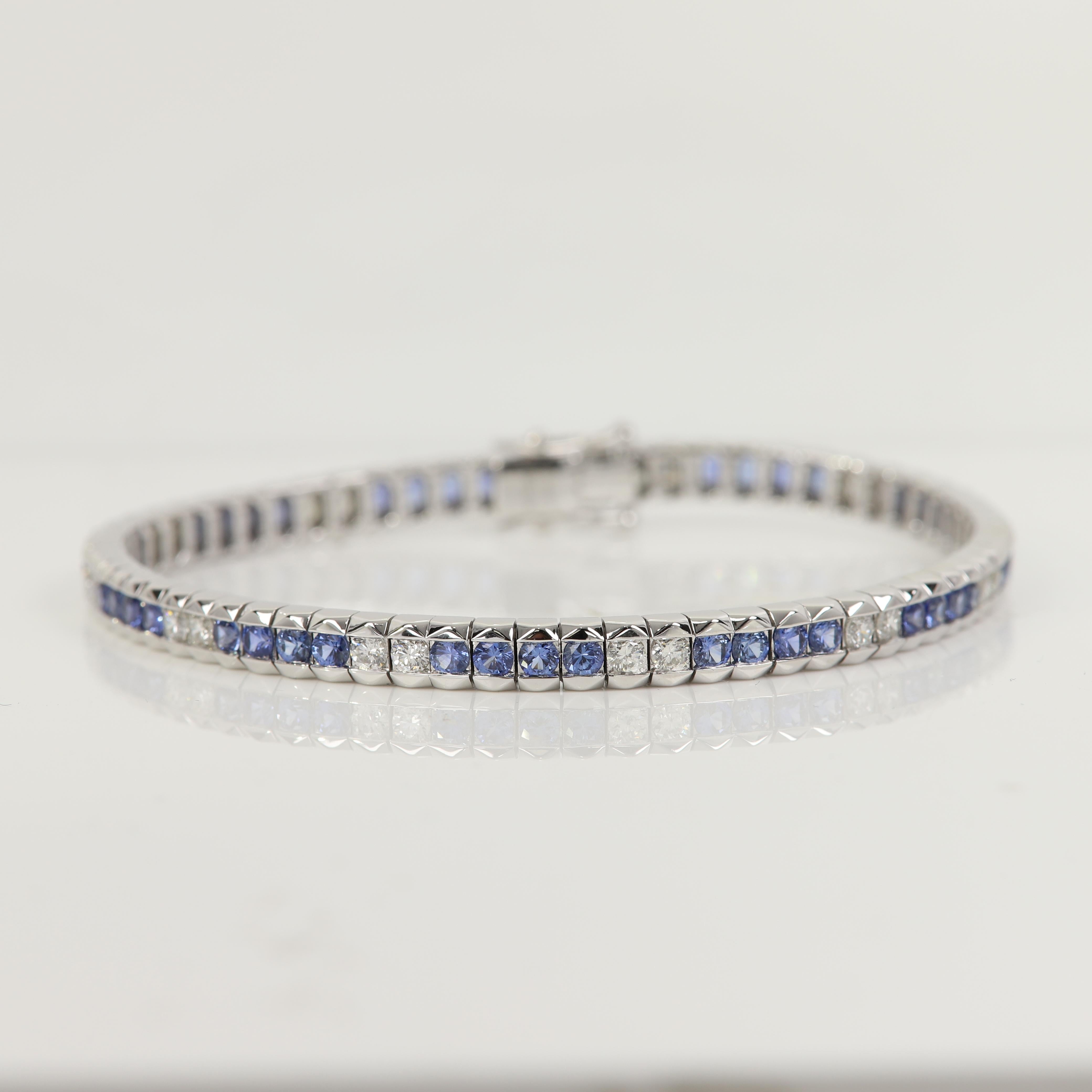 Blue Sapphire and Diamonds
all stones are natural
all stones are round shape

This Tennis Bracelet is unique in that it is a bit stiff and gives the felling of a semi bangle, when on the hand it is a nice round look and stays in its shape.
made of