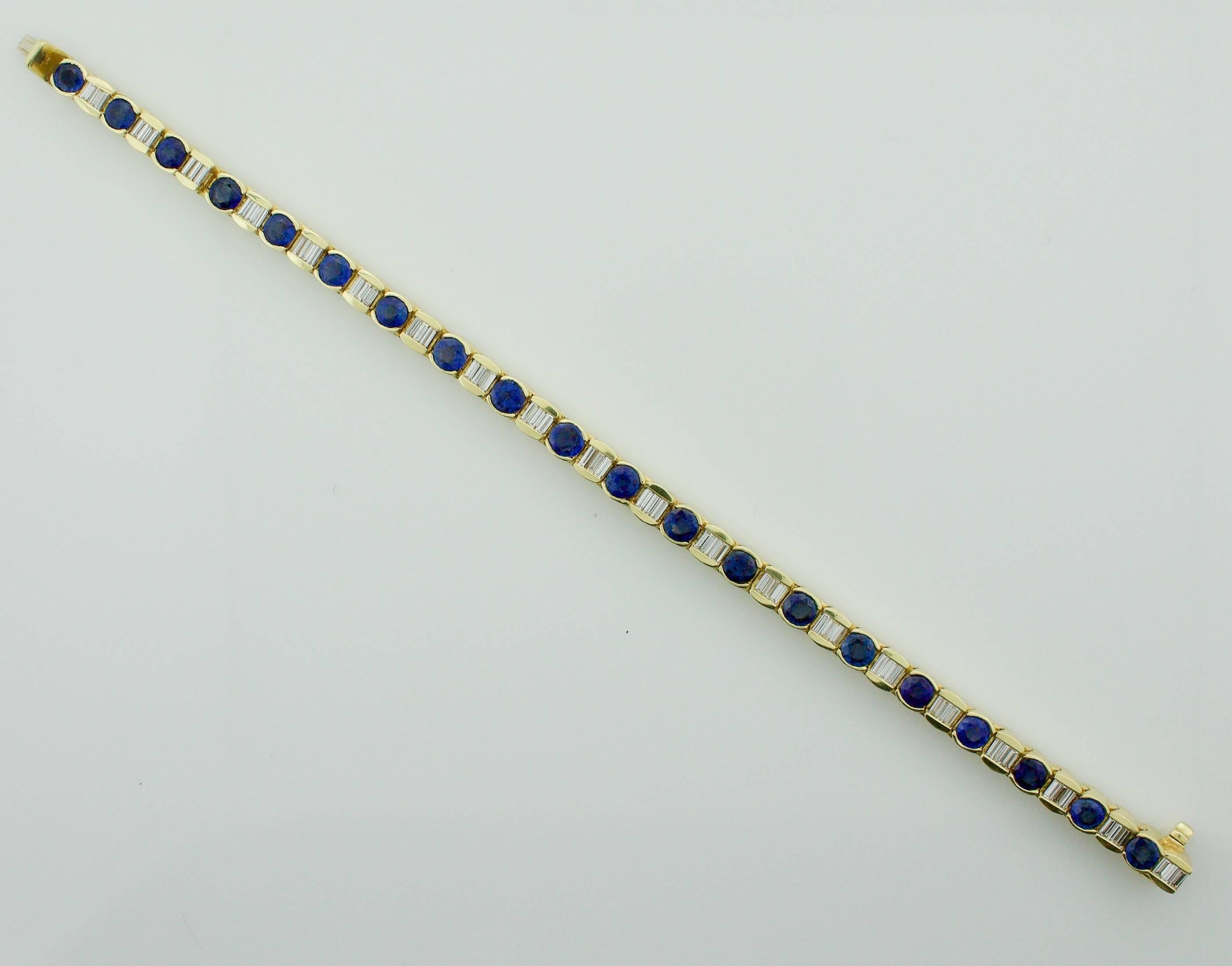 Sapphire and Diamond Tennis Bracelet in 18k
Twenty Round Sapphires weighing 6.00 carats approximately [Bright Blue with no imperfections visible to the naked eye]
Sixty Baguette Cut Diamonds weighing 1.80 carats approximately [GH VVS-VS]]
Solid