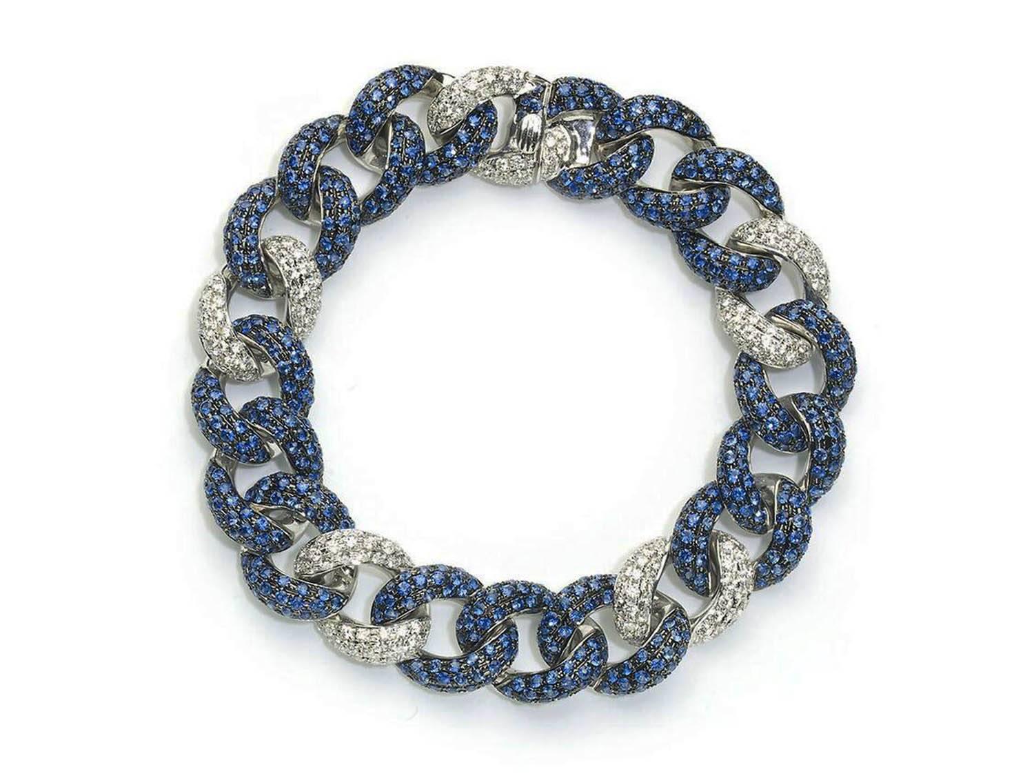 A sapphire and diamond bracelet, of curb link design, with a repeating pattern of three links pavé set with round faceted sapphires weighing an estimated total of 7.97ct and one link of pavé set round brilliant-cut diamonds weighing an estimated