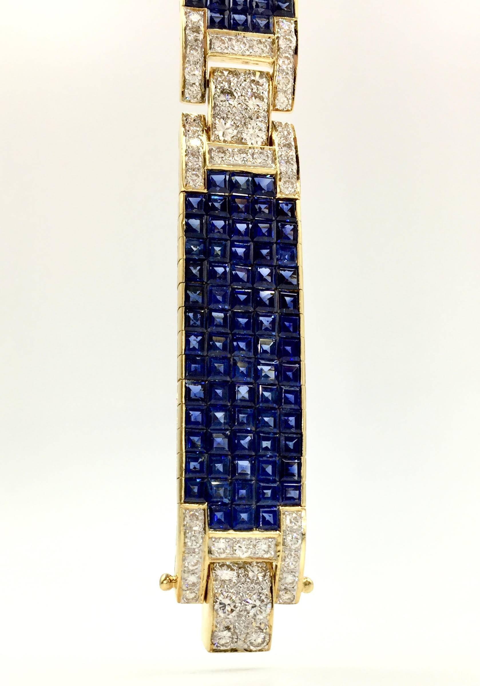 A truly exquisite find. This genuine blue sapphire and diamond bracelet is as comfortable as it is beautiful. 213 princess-cut blue sapphires are an incredible shade of royal blue with an approximate total weight of 35.00 carats. Approximately 4.00
