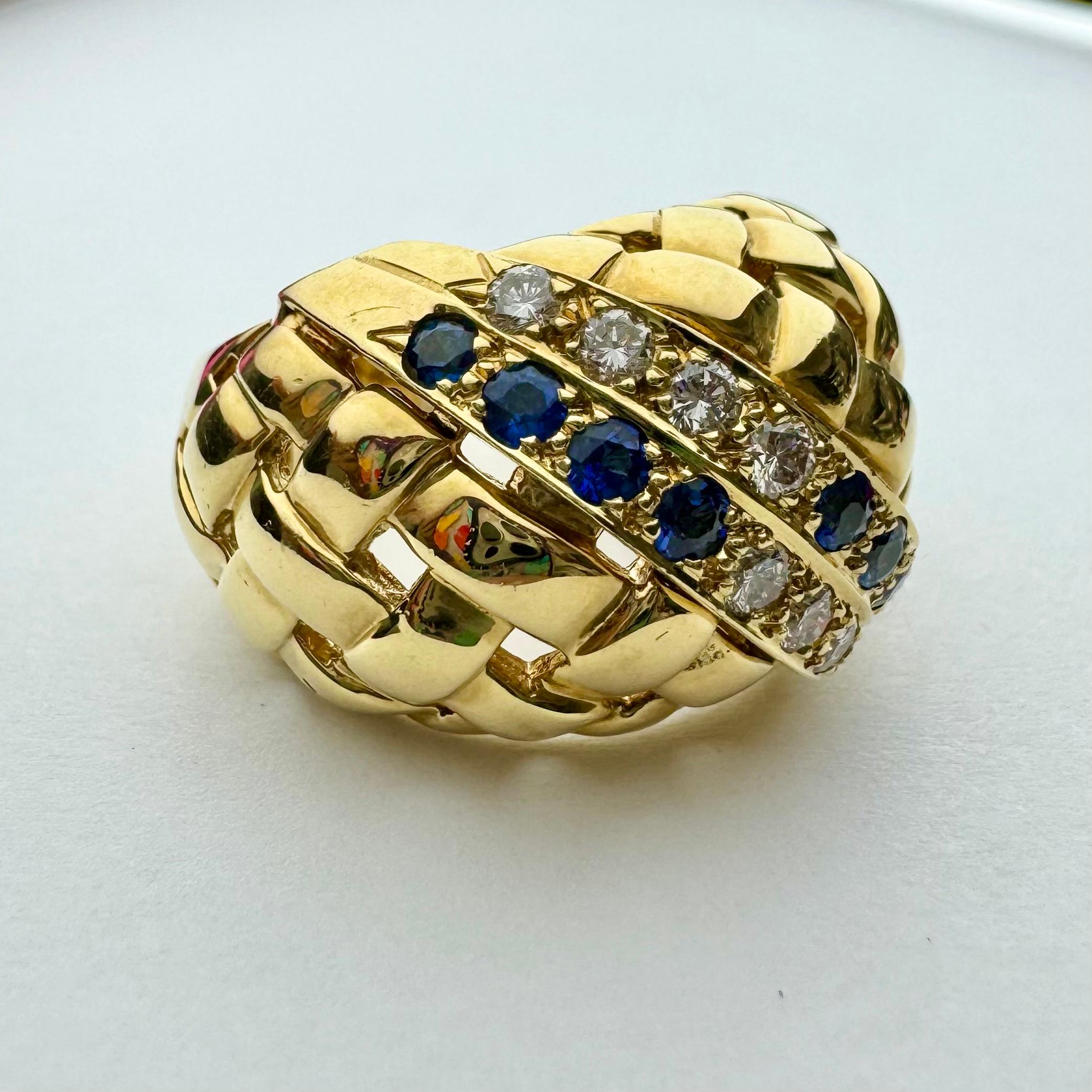 Elegant and stately dome sapphire and diamond ring set in solid 18k yellow gold. Ring features beautiful rich, golden woven design along with two band of gems adorned with dazzling blue sapphires and sparkling white diamonds. There are 8 white,