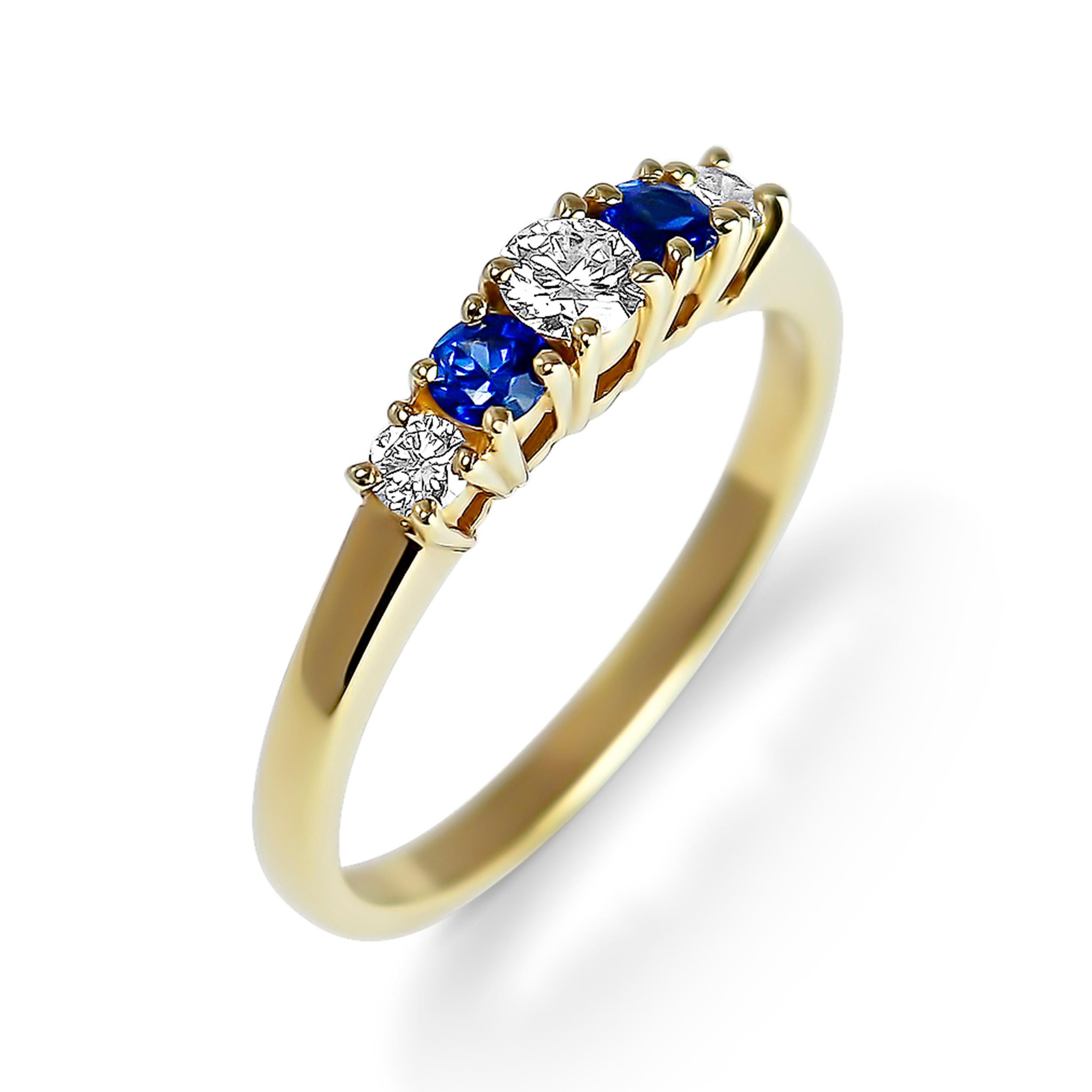 This 18 karat yellow gold ring features a 0.15 carat round brilliant diamond. The center stone is delicately highlighted by two sapphires with a deep blue color for a total weight of 0.21 carat and two round brilliant diamonds of a total weight of