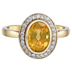 Ring aus 14-karätigem Gold mit Saphiren und Diamanten.