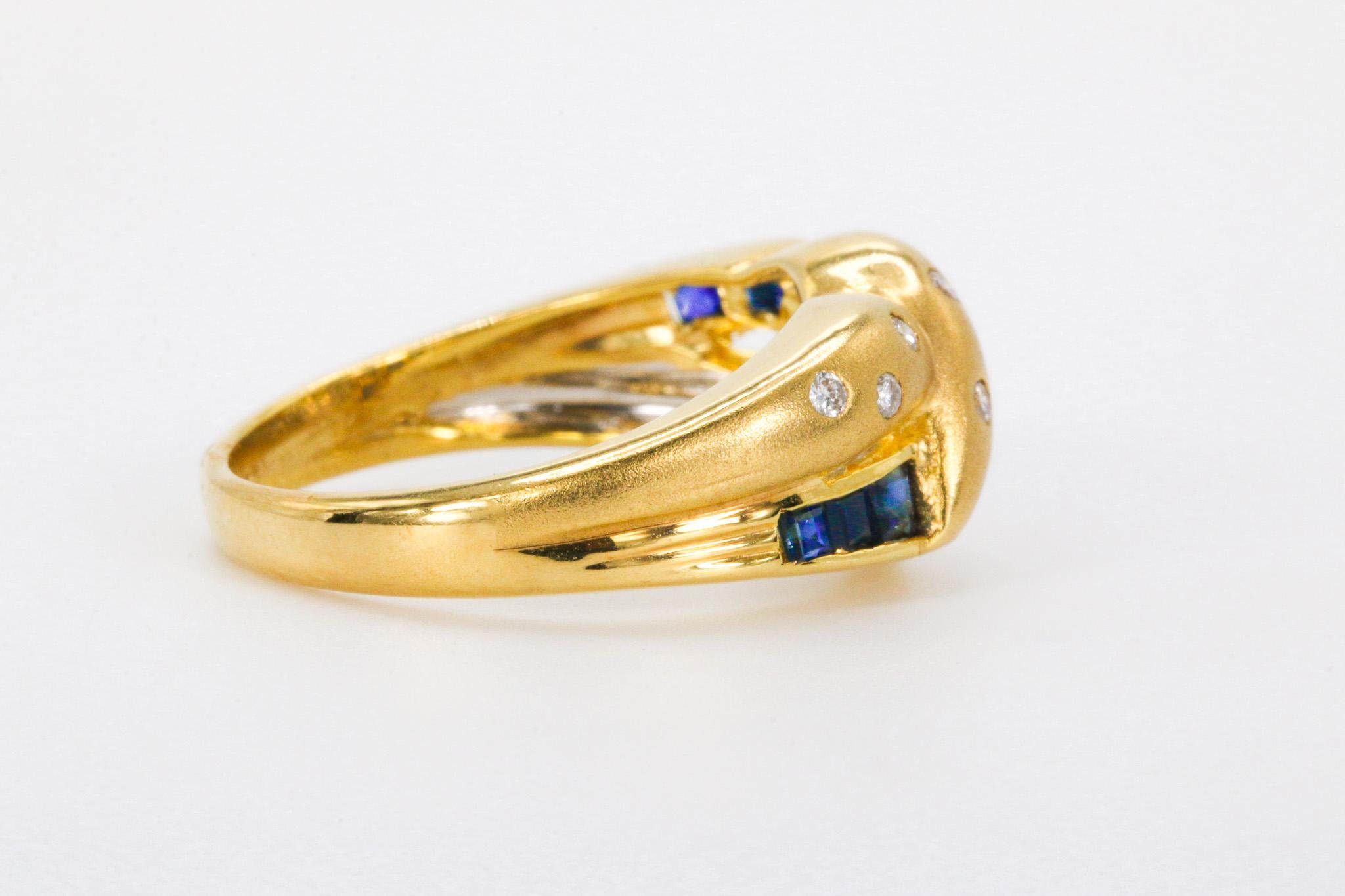 Sapphire and Diamonds Band in 18k Yellow Gold

This stunning 18K yellow gold band showcases a vibrant row of natural sapphires accented by sparkling natural diamonds, creating a timeless and elegant design suitable for daily wear or stacking with